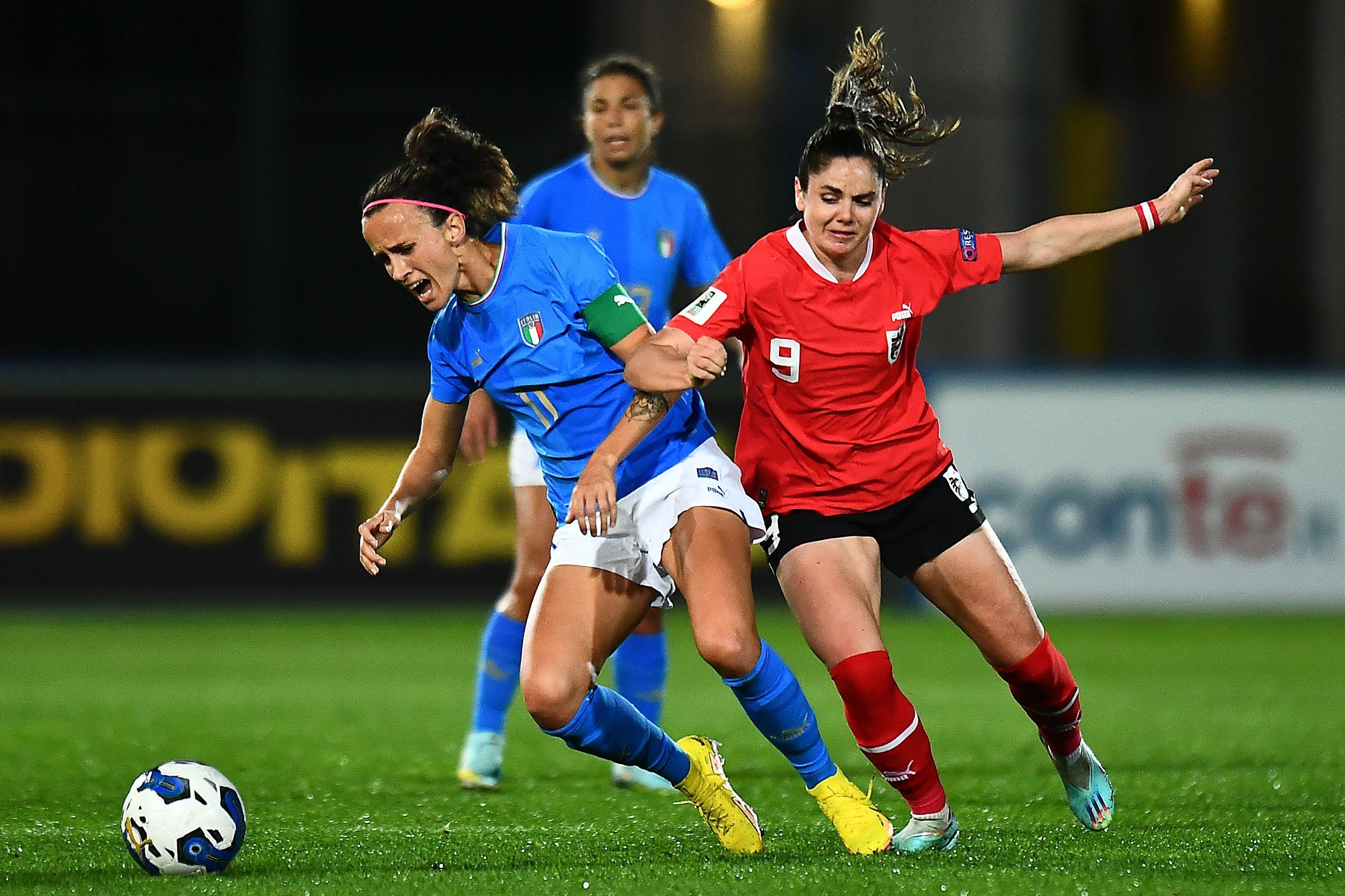 LIGNANO SABBIADORO, ITALY - NOVEMBER 11: Barbara Bonansea of Italy women competes for the ball with Sarah Zadrazil of Austria women during the Women's Frienly match between Italy and Austria at Stadio Guido Teghil on November 11, 2022 in Lignano Sabbiadoro, Italy. (Photo by Alessandro Sabattini/Getty Images)