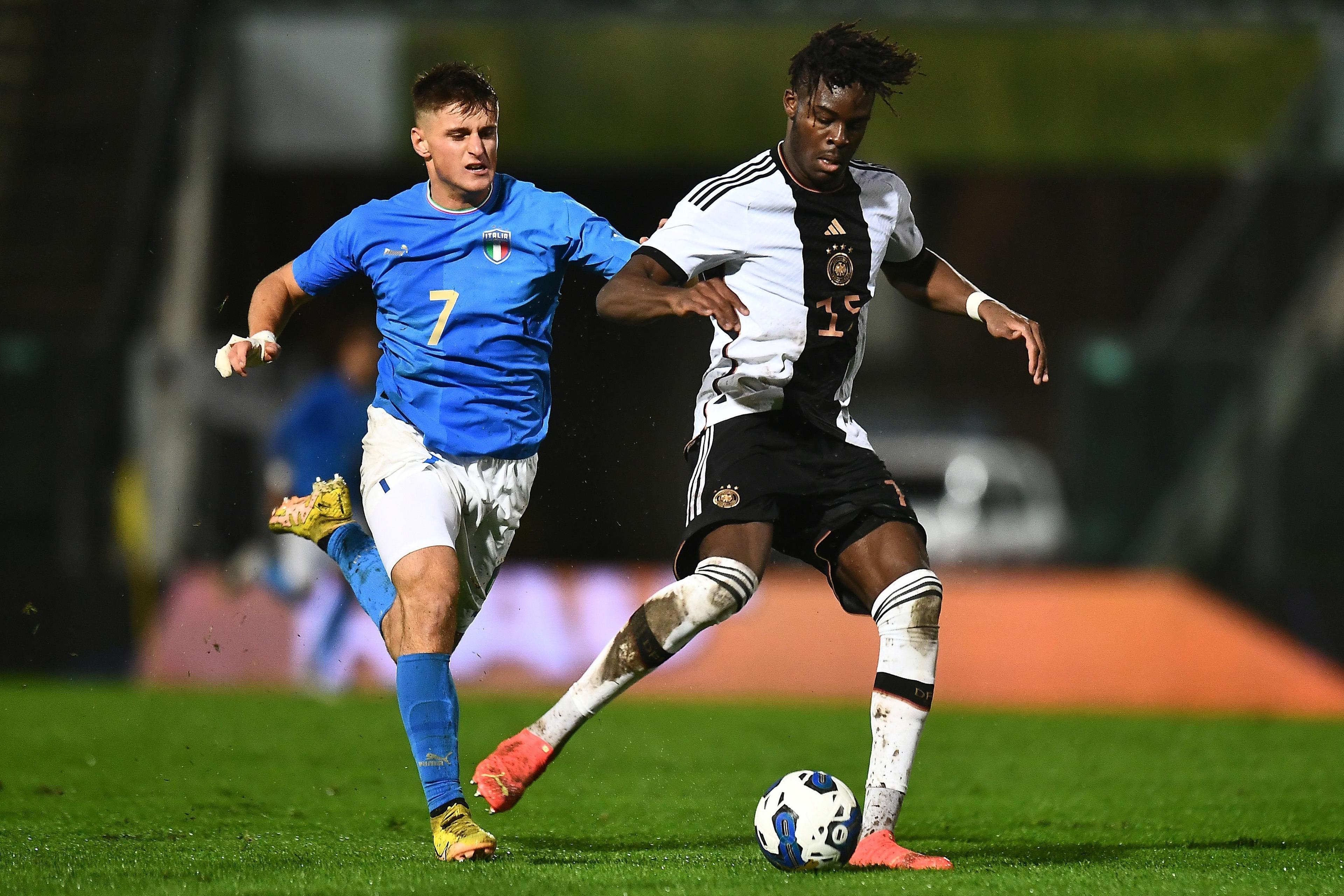 ANCONA, ITALY - NOVEMBER 19: Lorenzo Colombo of Italy U21 \\n competes for the ball with Yann Aurel Bisseck of  Germany U21during the International Friendly match between Italy U21 and Germany U21 \\u200Bat Del Conero Stadium on November 19, 2022 in Ancona, Italy. (Photo by Alessandro Sabattini/Getty Images