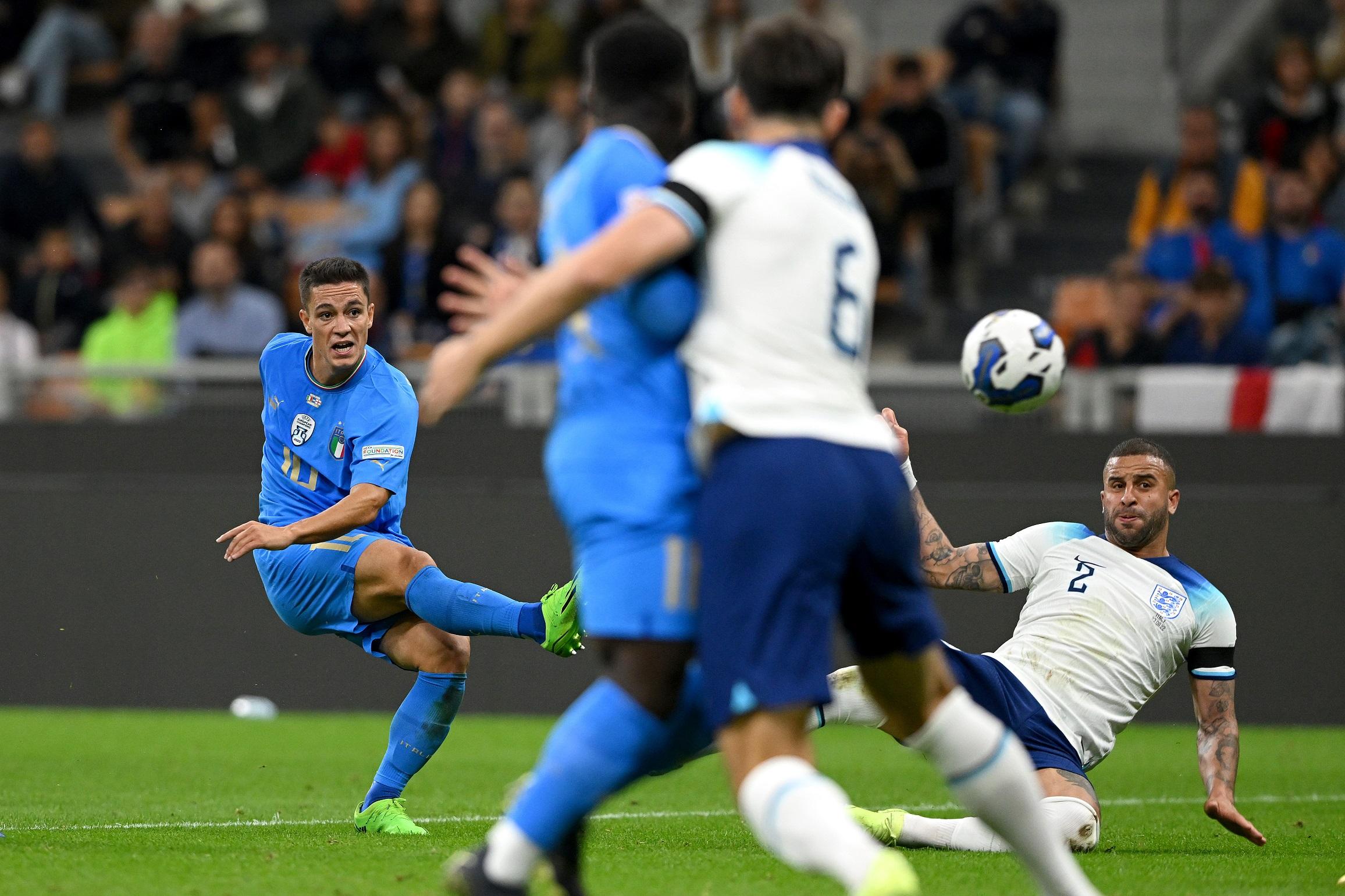MILAN, ITALY - SEPTEMBER 23: Giacomo Raspadori of Italy scores their side's first goal whilst under pressure from Kyle Walker of England during the UEFA Nations League League A Group 3 match between Italy and England at San Siro on September 23, 2022 in Milan, Italy. (Photo by Claudio Villa/Getty Images)