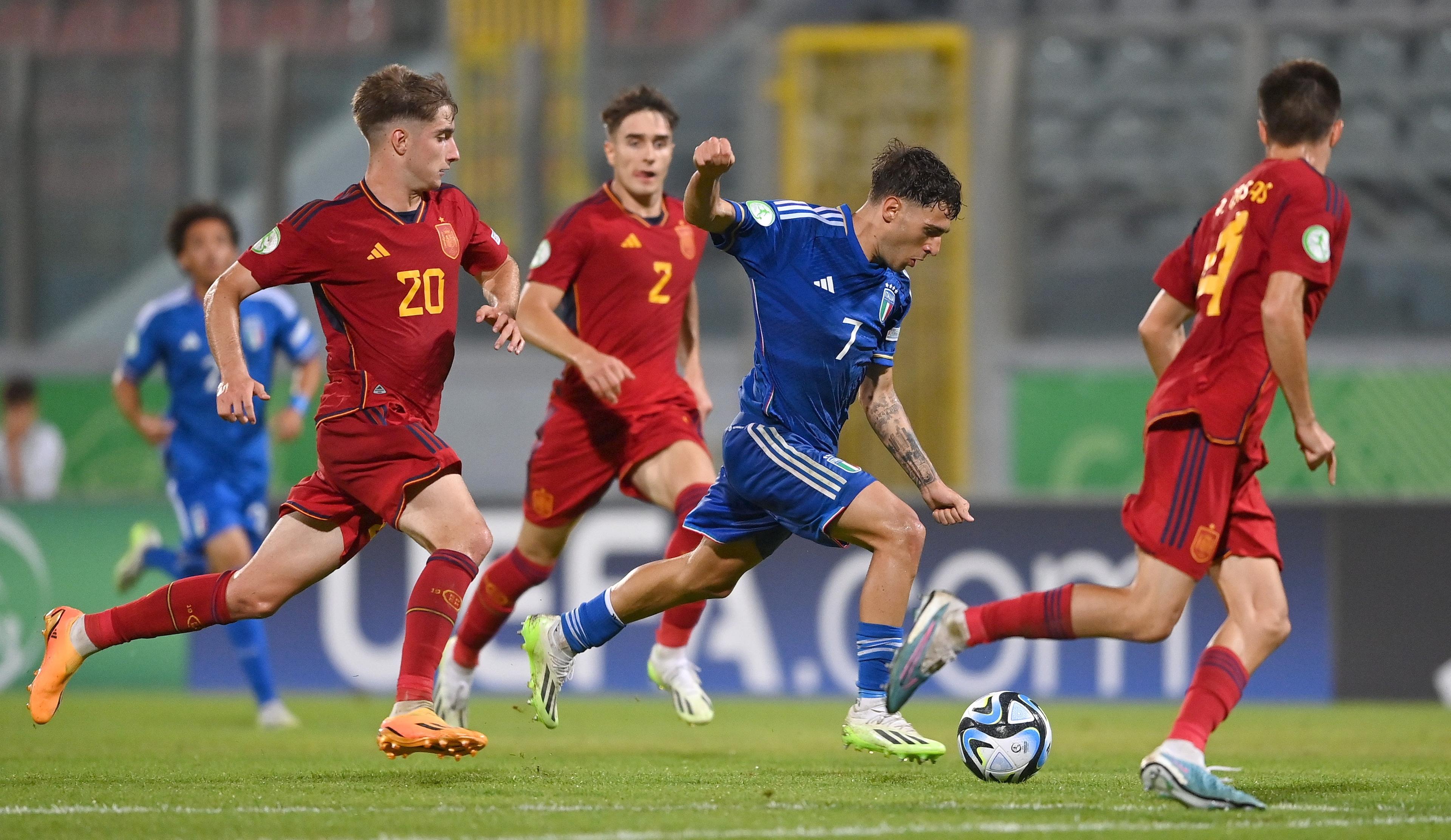 TA' QALI, MALTA - JULY 13: Luis Hasa of Italy in action against César Palacios of Spain during the UEFA European Under-19 Championship 2022/23 semi-final match between Spain and Italy at the National Stadium on July 13, 2023 in Ta' Qali, Malta. (Photo by Seb Daly - Sportsfile/UEFA via Getty Images)