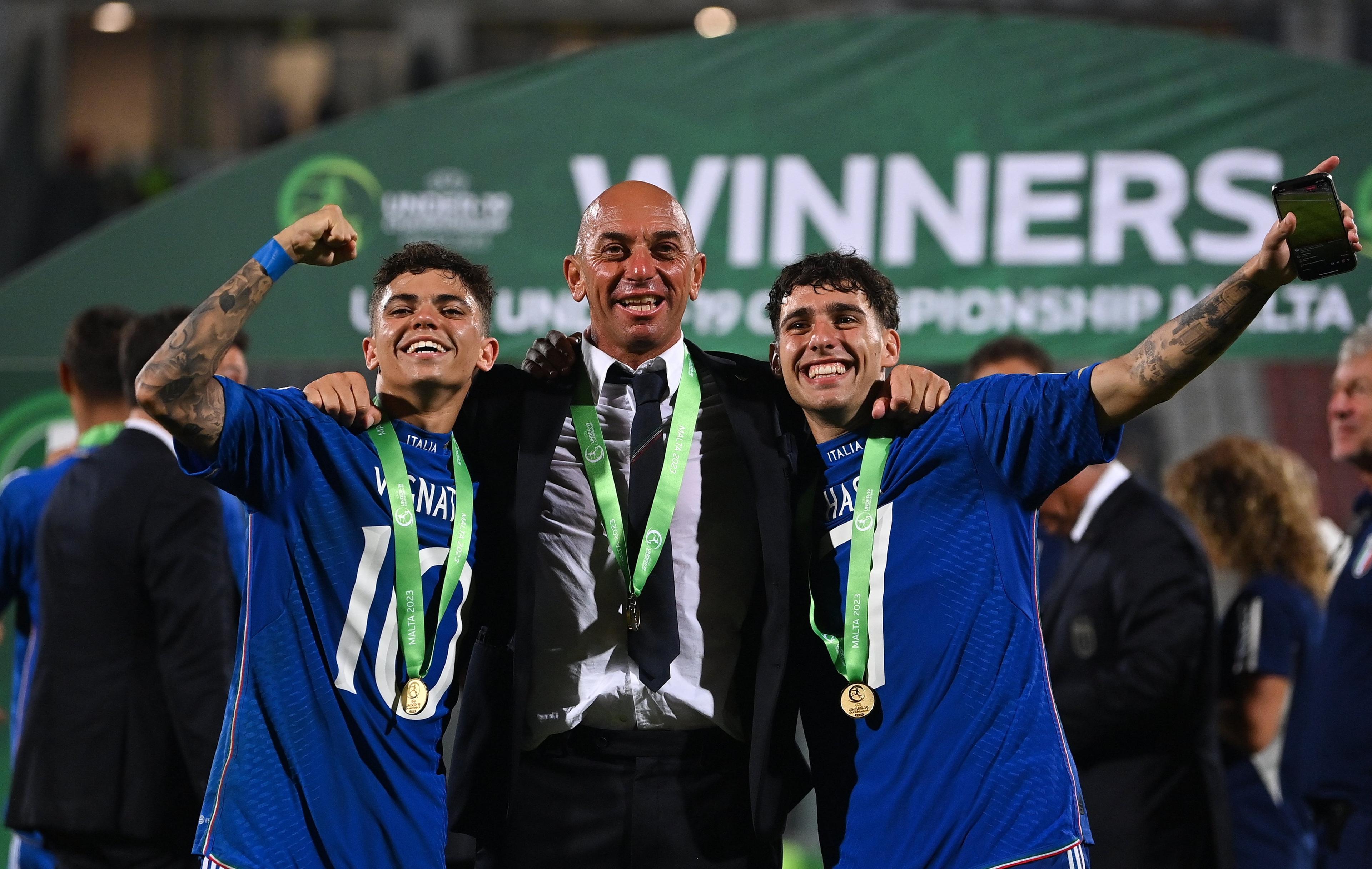 TA' QALI, MALTA - JULY 16: Italy head coach Alberto Bollini, centre, with Samuele Vignato, left, and Luis Hasa of Italy after the UEFA European Under-19 Championship 2022/23 final match between Portugal and Italy at the National Stadium on July 16, 2023 in Ta' Qali, Malta. (Photo by Seb Daly - Sportsfile/UEFA via Getty Images)