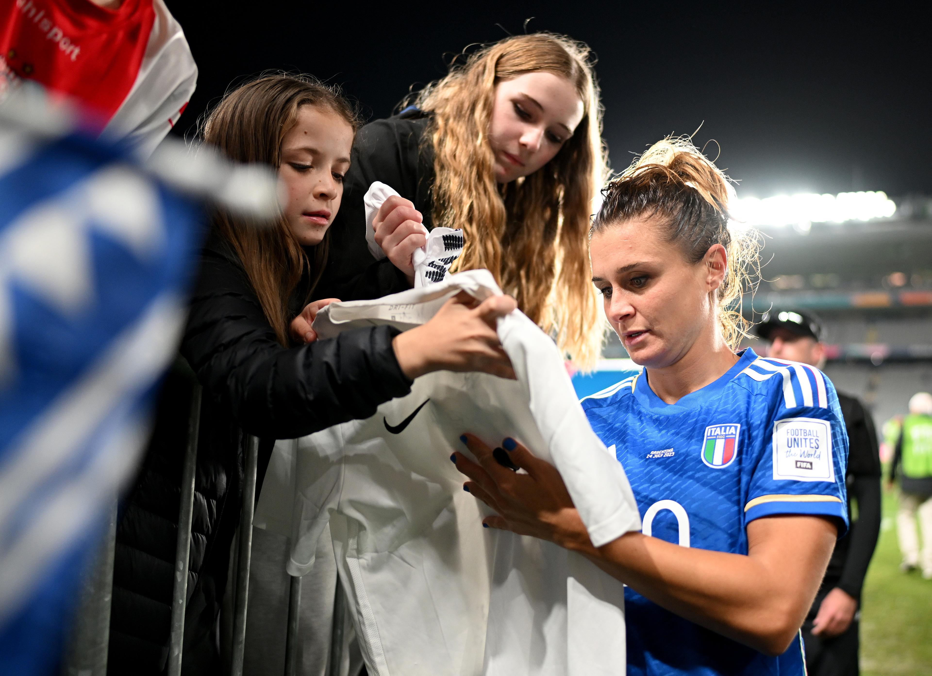 AUCKLAND, NEW ZEALAND - JULY 24: Cristiana Girelli of Italy signs autographs for fans after her team's 1-0 victory in the FIFA Women's World Cup Australia & New Zealand 2023 Group G match between Italy and Argentina at Eden Park on July 24, 2023 in Auckland / TÄmaki Makaurau, New Zealand. (Photo by Hannah Peters - FIFA/FIFA via Getty Images)