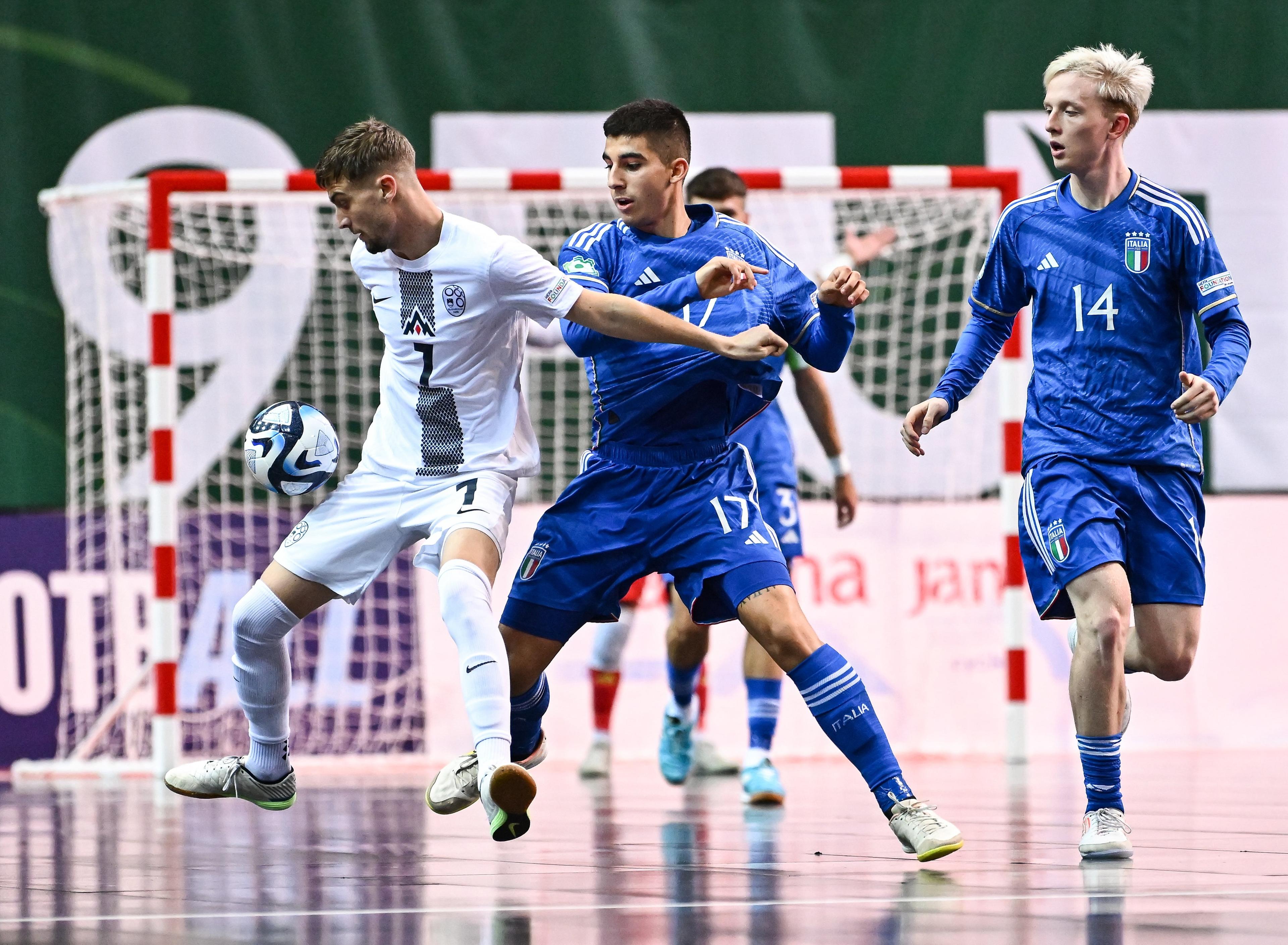 POREC, CROATIA - SEPTEMBER 6: Vid Kos of Slovenia in action against Giulio Perazzetta of Italy during the UEFA Under-19 Futsal EURO 2023 match between Slovenia and Italy at the Zatika Arena on 6 September 2023 in Porec, Croatia. (Photo by Piaras Ã“ MÃdheach - Sportsfile/UEFA via Getty Images)