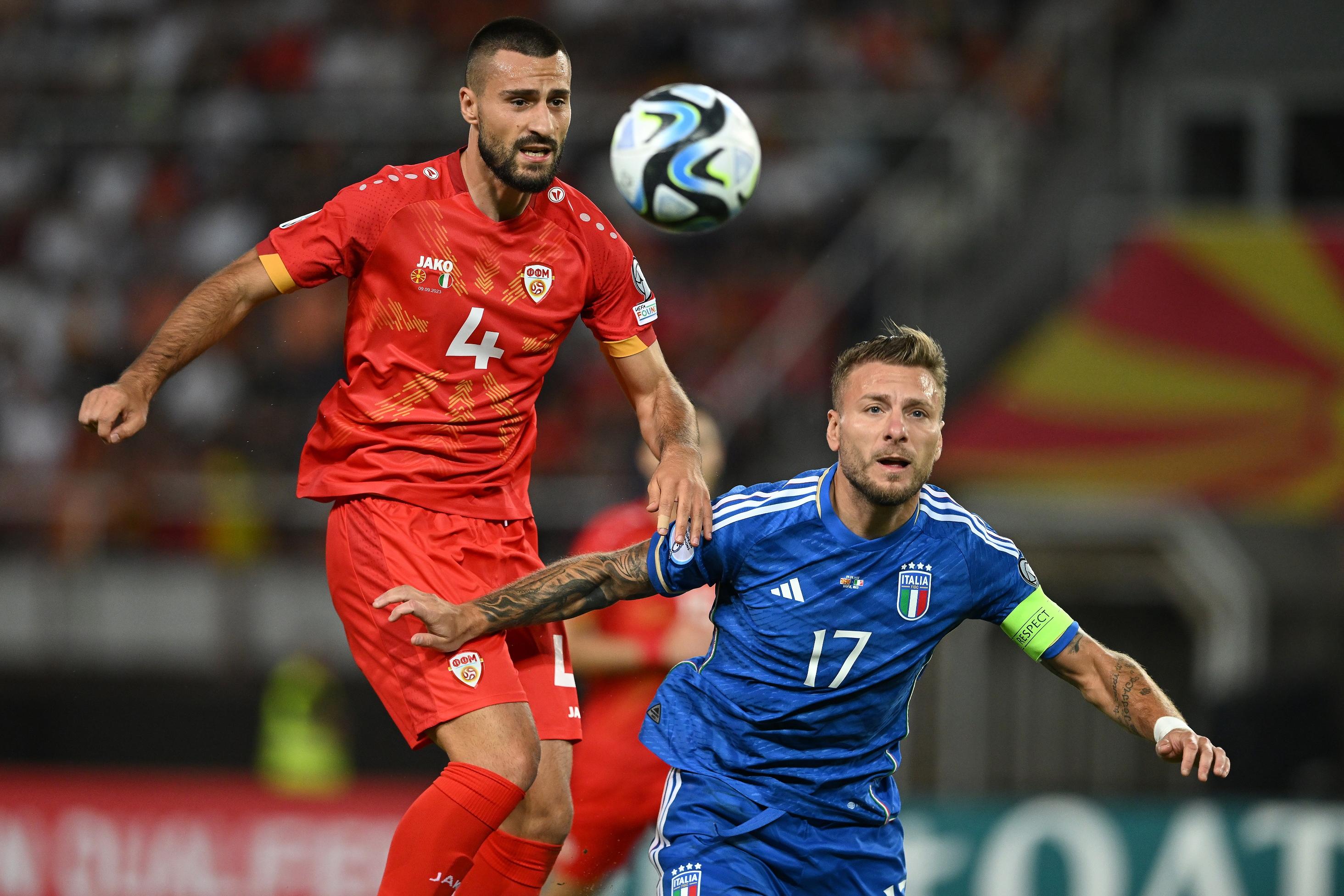SKOPJE, MACEDONIA - SEPTEMBER 09:  Ciro Immobile of Italy competes for the ball with Gjoko Zajkov of North Macedonia during the UEFA EURO 2024 European qualifier match between North Macedonia and Italy at National Arena Todor Proeski on September 09, 2023 in Skopje, Macedonia. (Photo by Claudio Villa/Getty Images)
