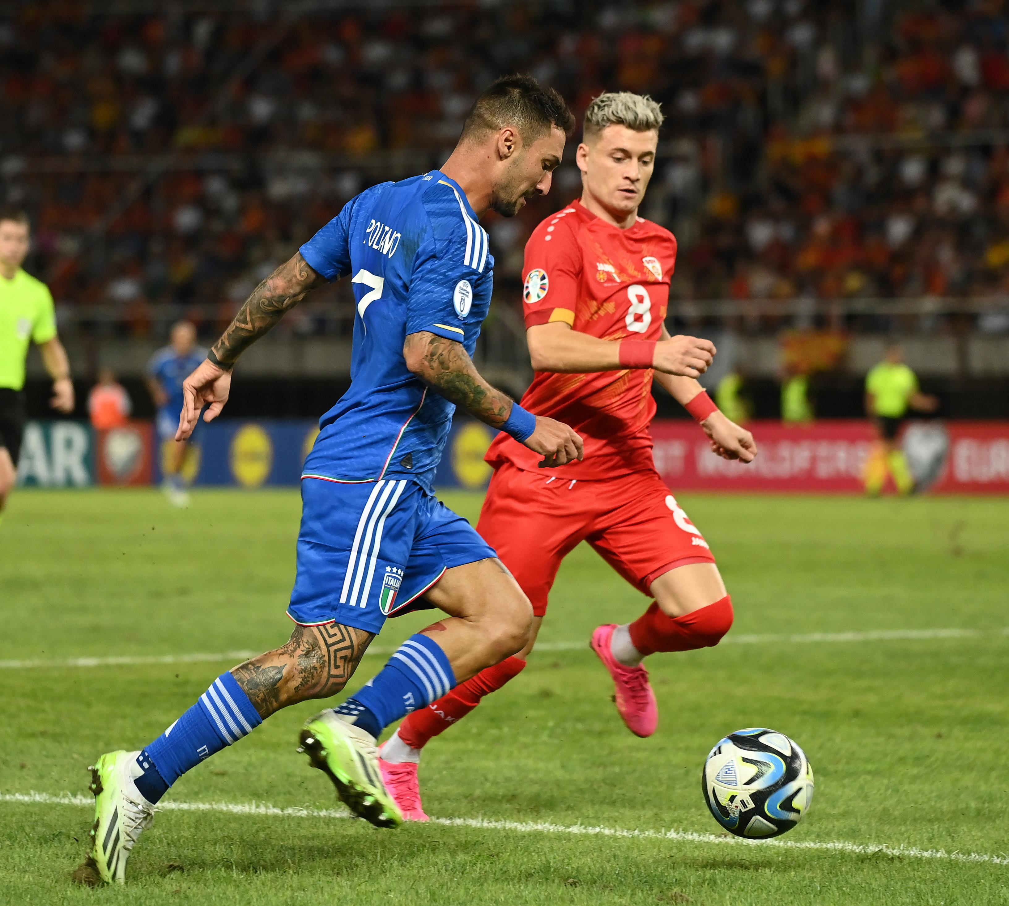 SKOPJE, MACEDONIA - SEPTEMBER 09: Matteo Politano of Italy competes for the ball with Ezgjan Alioski of North Macedonia during the UEFA EURO 2024 European qualifier match between North Macedonia and Italy at National Arena Todor Proeski on September 09, 2023 in Skopje, Macedonia. (Photo by Claudio Villa/Getty Images)
