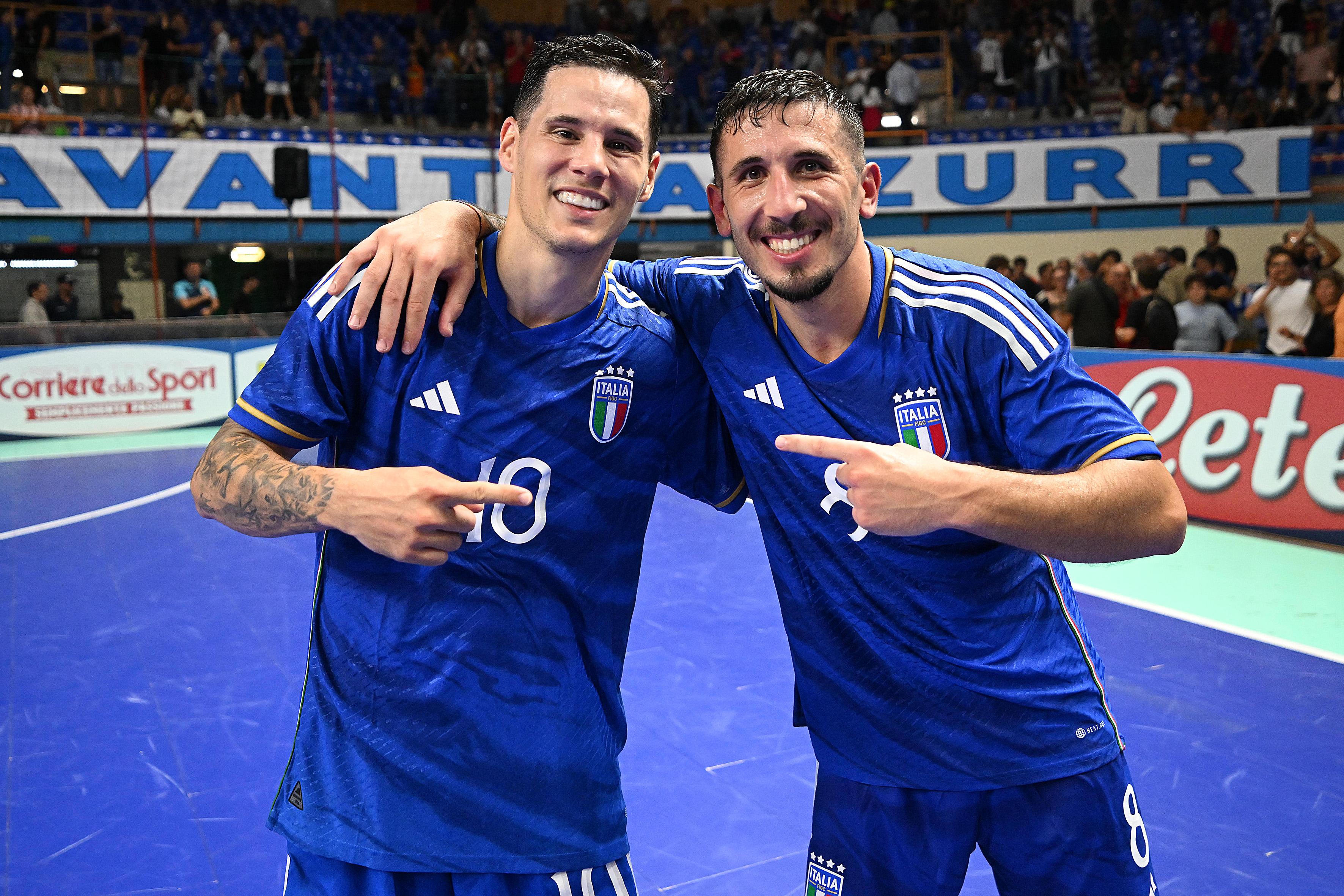 EBOLI, ITALY - SEPTEMBER 15: Alex Merlim and Carmelo Musumeci of Italy celebrate the victory afterg the FIFA Futsal World Cup 2024 Qualifier match between Italy and Slovenia on September 15, 2023 in Eboli, Italy. (Photo by Francesco Pecoraro/Getty Images)