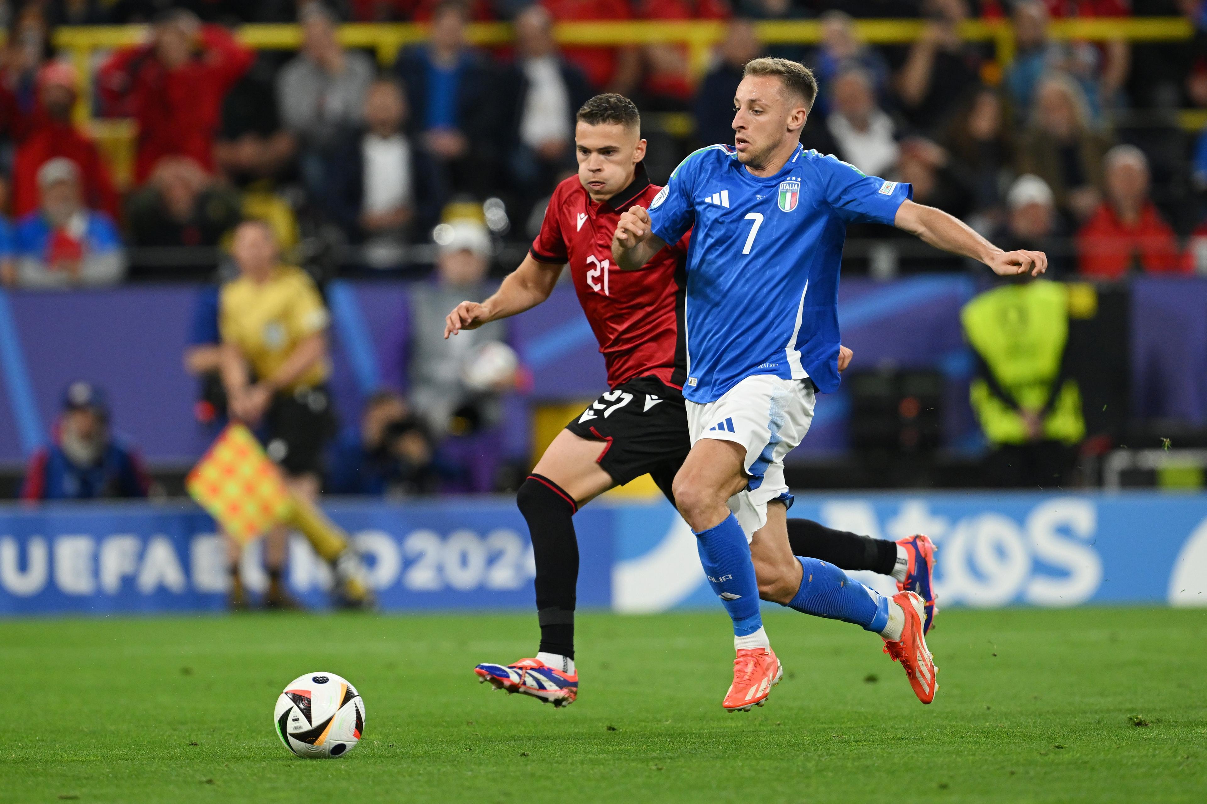 DORTMUND, GERMANY - JUNE 15: Kristjan Asllani of Albania and Davide Frattesi of Italy battle for possession during the UEFA EURO 2024 group stage match between Italy and Albania at Football Stadium Dortmund on June 15, 2024 in Dortmund, Germany. (Photo by Claudio Villa/Getty Images for FIGC)