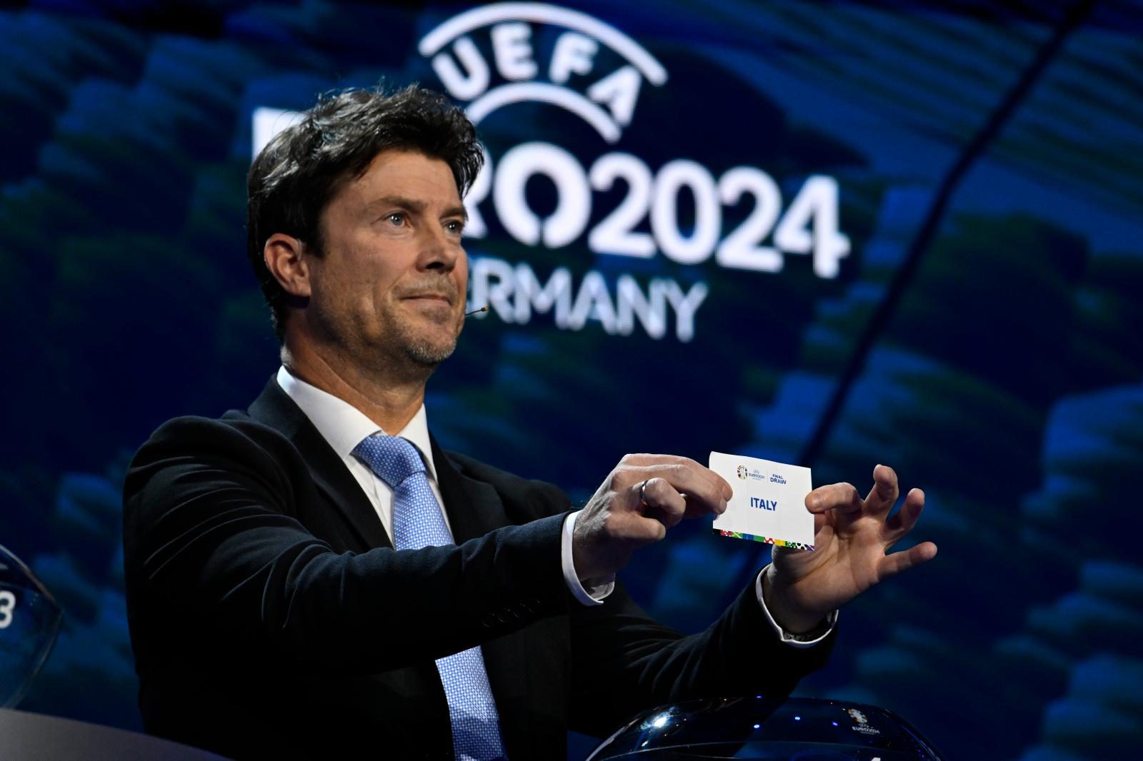 HAMBURG, GERMANY - DECEMBER 2: Special guest Brian Laudrup draws the card for Italy during the UEFA EURO 2024 Final Tournament Draw ceremony at the Elbphilharmonie on December 2, 2023, in Hamburg, Germany. (Photo by Kristian Skeie - UEFA/UEFA via Getty Images)