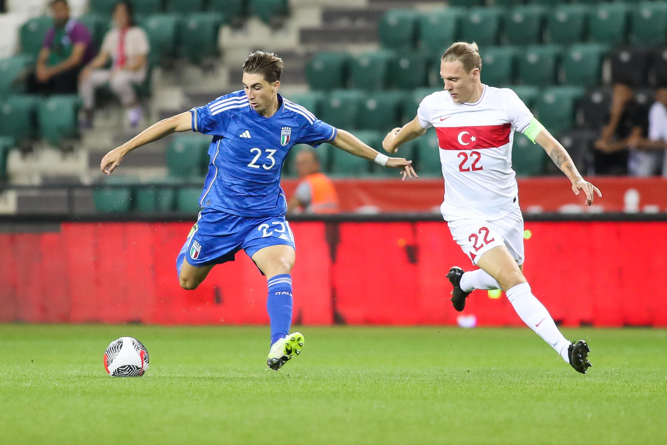 KOCAELI, TURKEY - SEPTEMBER 12: Fabio Miretti of Italy is challenged by Serdar Saatci of Turkey during UEFA European Under-21 Championship Qualifier match between Turkey and Italy at on September 12, 2023 in Kocaeli, Turkey. (Photo by Ahmad Mora/Getty Images)