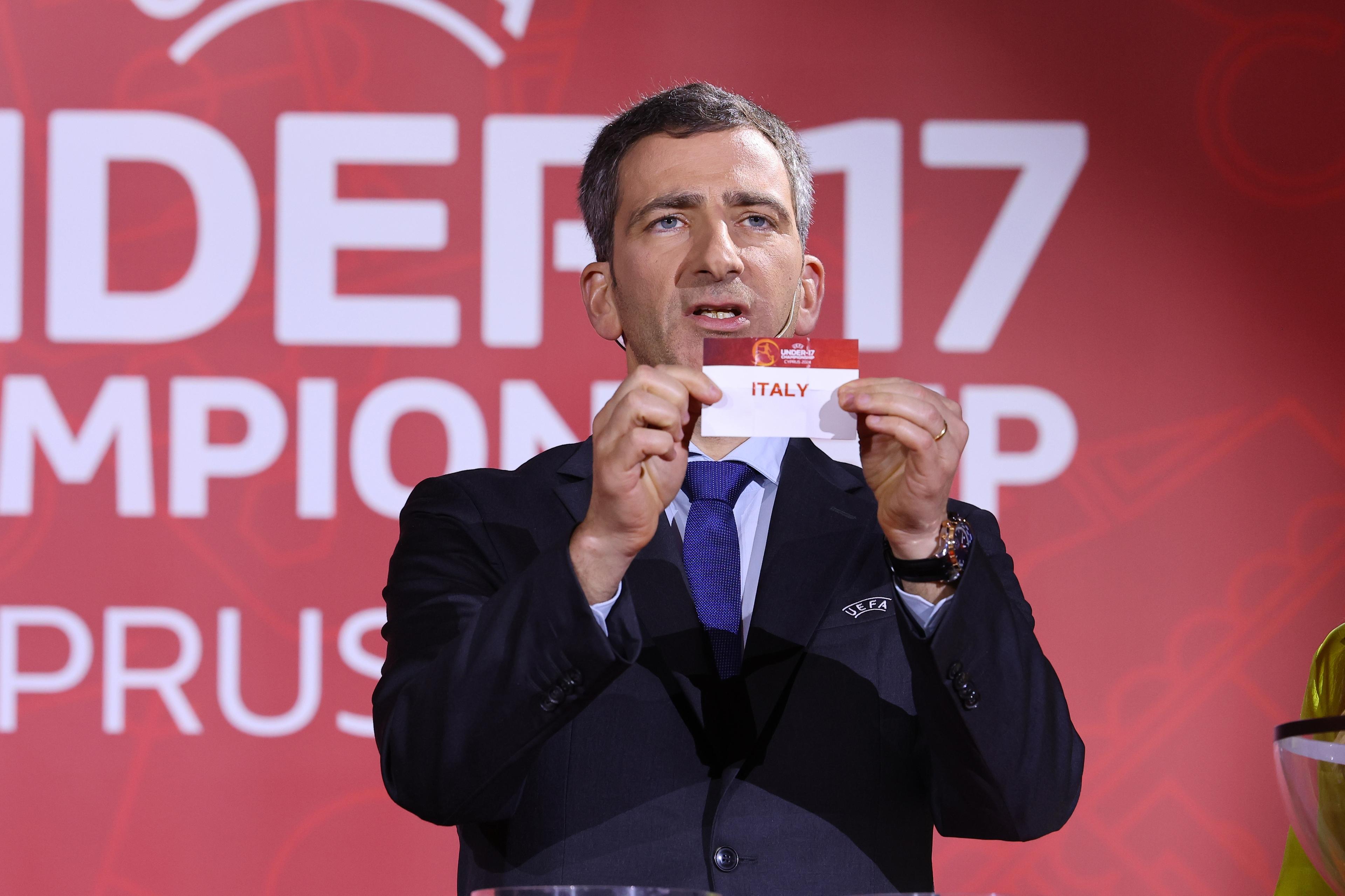 AYIA NAPA, CYPRUS – APRIL 3: UEFA Head of Men’s National Team Competitions Marcello Alleca draws out the card of Italy during the UEFA European Under-17 Championship 2023/24 Final Tournament Draw at the Ayia Napa Marina on April 3, 2024, in Ayia Napa, Cyprus. (Photo by Sakis Savvides/ Supplied by Cyprus Football Association)