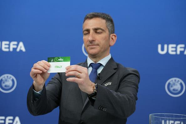 NYON, SWITZERLAND - MAY 3: UEFA Head of Men's National Team Competition Marcello Alleca draws out the card of Italy during the UEFA European Under-19 Championship 2025 Qualifying Round Draw at the UEFA Headquarters, the House of the European Football, on May 3, 2024, in Nyon, Switzerland. (Photo by Nemanja Basevic - UEFA/UEFA via Getty Images)