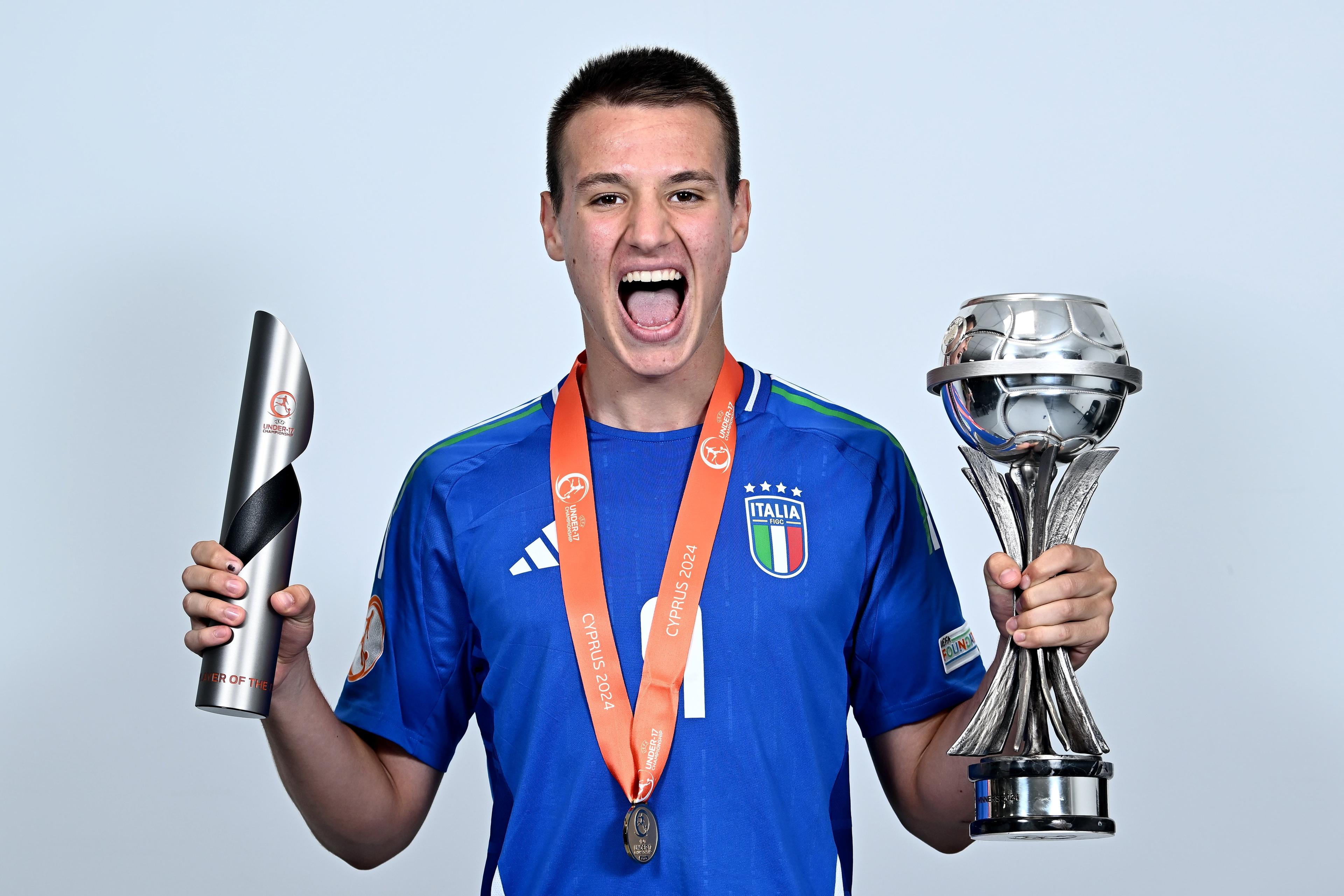 LIMASSOL, CYPRUS - June 05: Francesco Camarda of Italy with the trophy and his Player of the Tournament trophy during the winners\\' shoot after the UEFA European Under-17 Championship 2023/2024 Final match between Italy and Portugal at Limassol Stadium on June 05, 2024 in Limassol, Cyprus. (Photo by Piaras \\u00C3\\u201C M\\u00C3\\u00ADdheach - Sportsfile/UEFA via Getty Images)