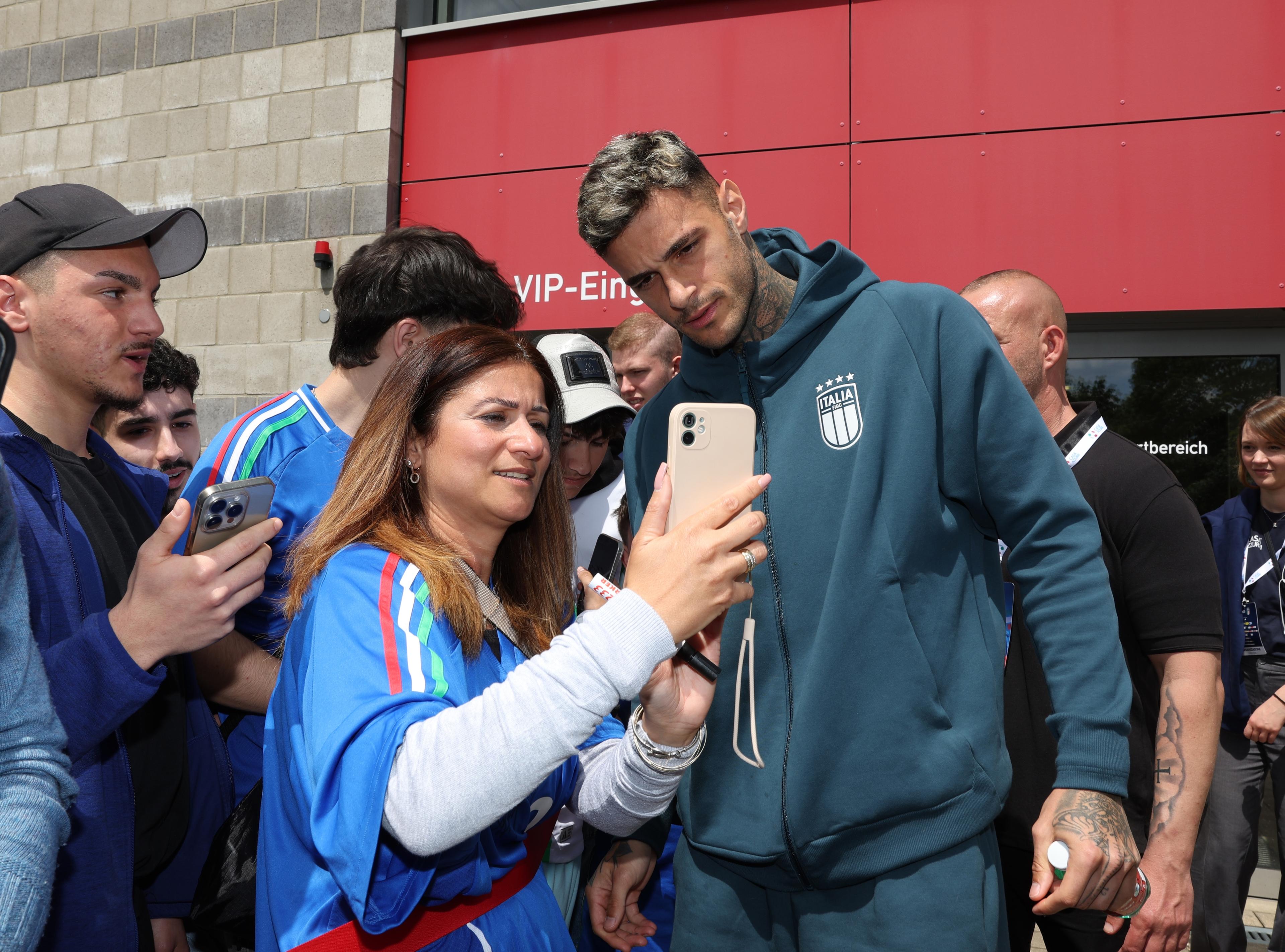 ISERLOHN, GERMANY - JUNE 13: Gianluca Scamacca of Italy signs autographs after Italy press conference at Hemberg-Stadion on June 13, 2024 in Iserlohn, Germany. (Photo by Claudio Villa/Getty Images for FIGC)