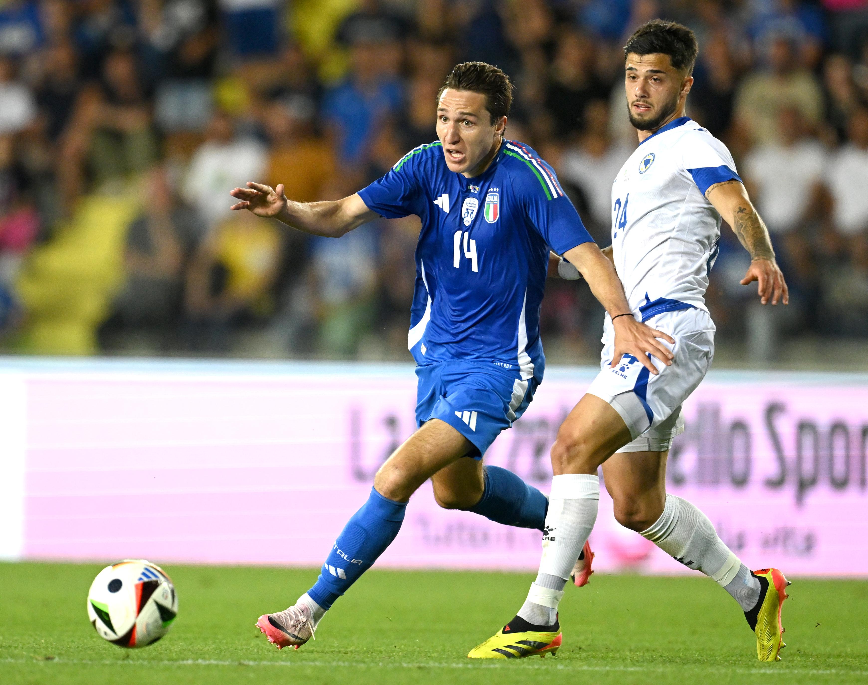 EMPOLI, ITALY - JUNE 09: Federico Chiesa of Italy competes for the ball with Jusuf Gazibegovic of Bosnia & Herzegovina during International Friendly beetween Italy and Bosnia & Herzegovina at Stadio Carlo Castellani on June 09, 2024 in Empoli, Italy. (Photo by Claudio Villa/Getty Images)