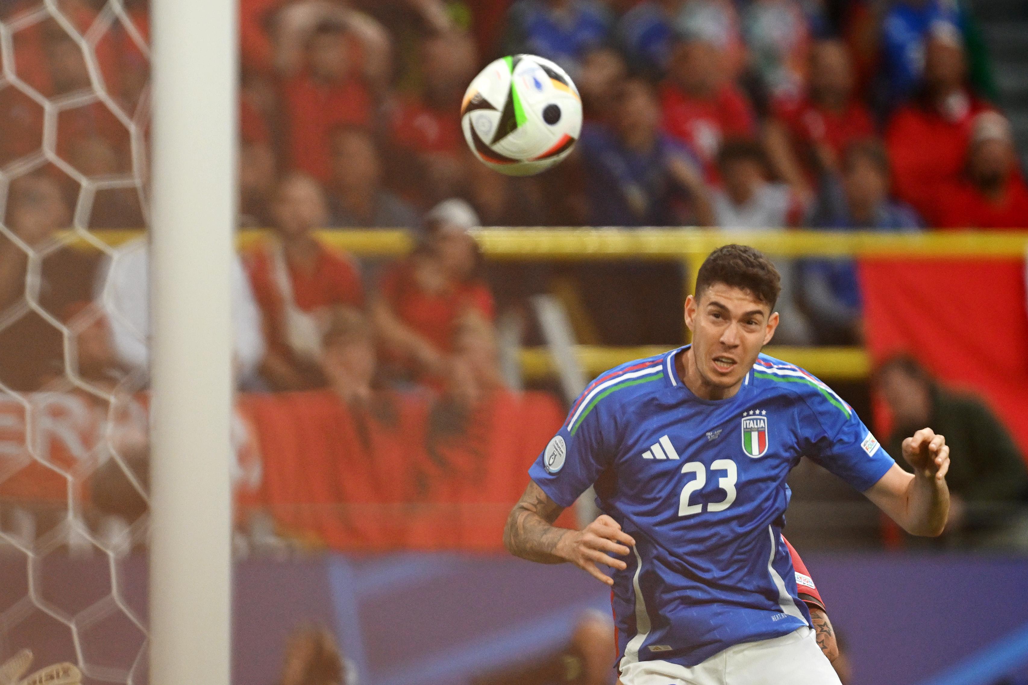 DORTMUND, GERMANY - JUNE 15: Alessandro Bastoni of Italy scores his team's first goal with a header as Thomas Strakosha of Albania fails to make a save during the UEFA EURO 2024 group stage match between Italy and Albania at Football Stadium Dortmund on June 15, 2024 in Dortmund, Germany. (Photo by Claudio Villa/Getty Images for FIGC)