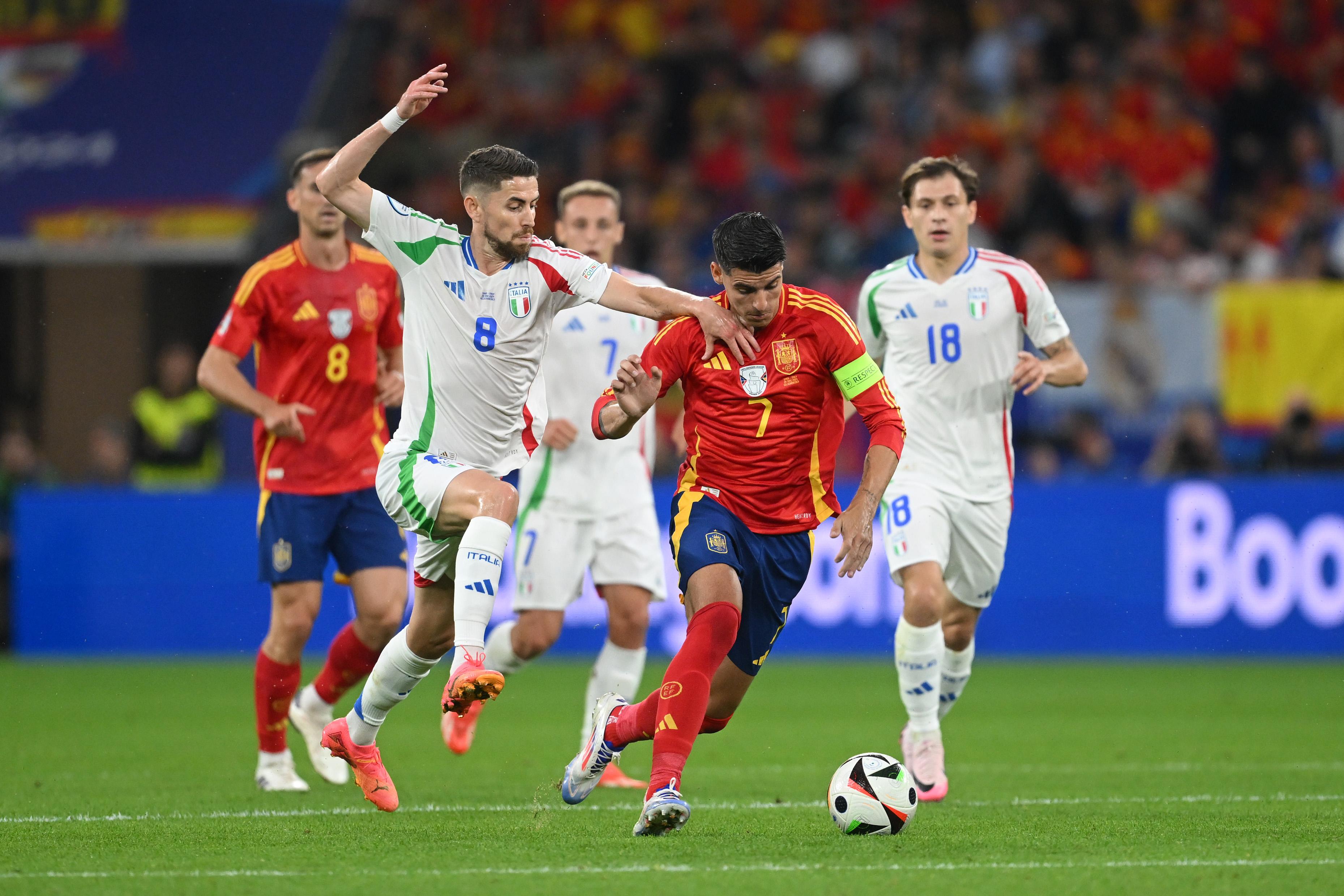 GELSENKIRCHEN, GERMANY - JUNE 20: Alvaro Morata of Spain runs with the ball whilst under pressure from Fabian Ruiz of Spain during the UEFA EURO 2024 group stage match between Spain and Italy at Arena AufSchalke on June 20, 2024 in Gelsenkirchen, Germany. (Photo by Michael Regan - UEFA/UEFA via Getty Images)