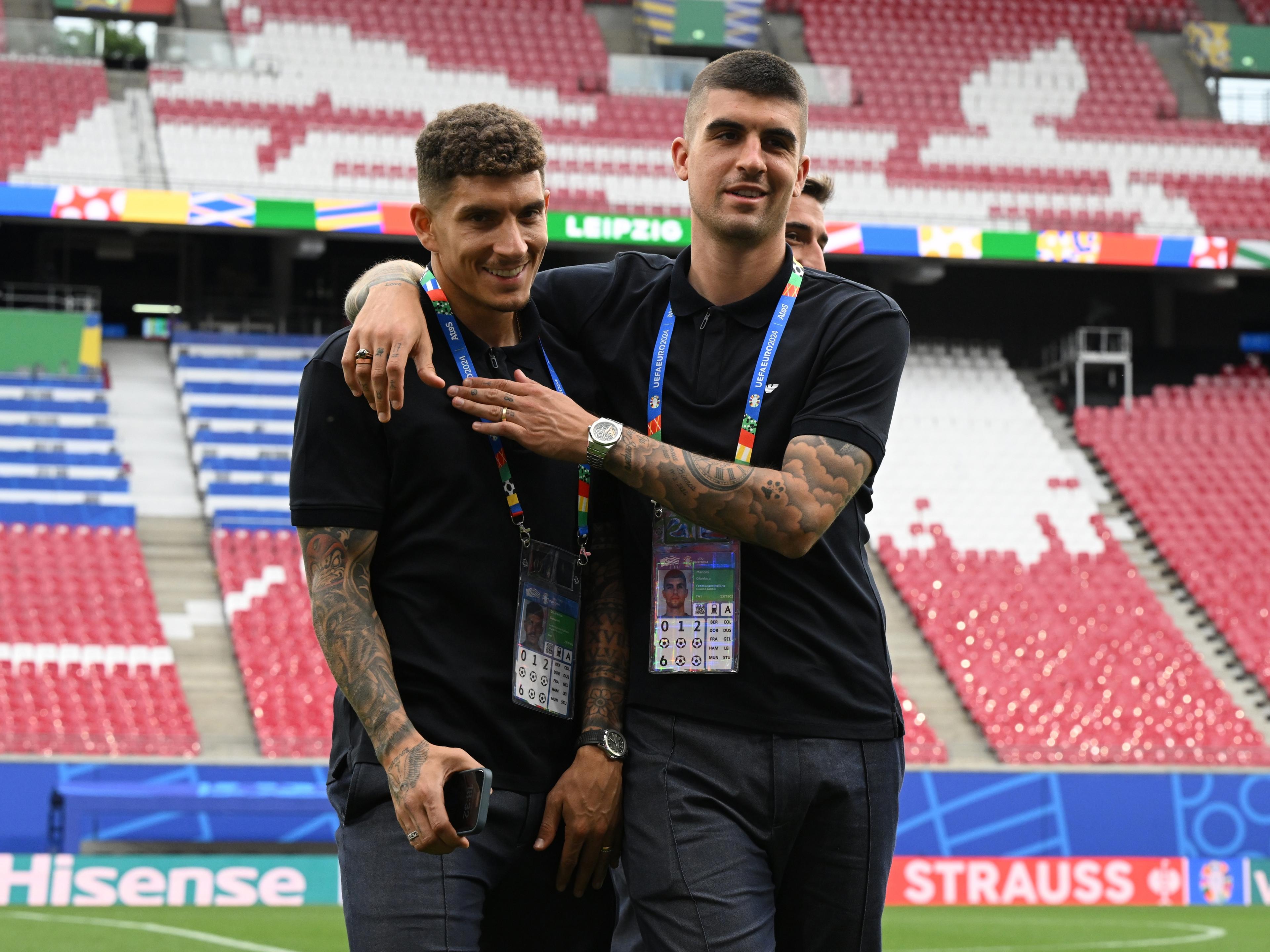 LEIPZIG, GERMANY - JUNE 23: Giovanni Di Lorenzo and Gianluca Mancini of Italy inspect the pitch prior to a Italy training session at Football Stadium Leipzig on June 23, 2024 in Leipzig, Germany. (Photo by Claudio Villa/Getty Images for FIGC)