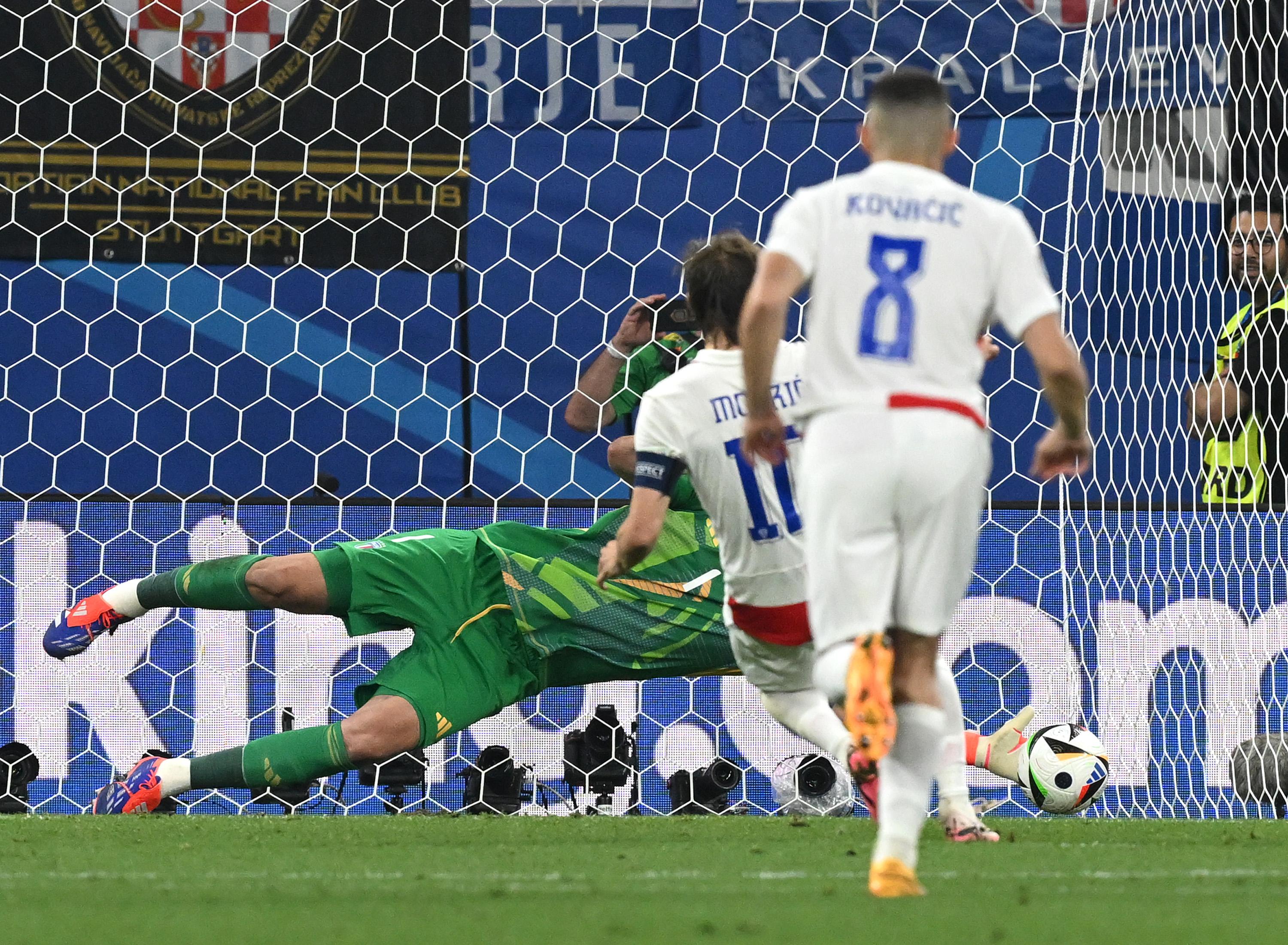 LEIPZIG, GERMANY - JUNE 24: Gianluigi Donnarumma of Italy saves a penalty kick from Luka Modric of Croatia during the UEFA EURO 2024 group stage match between Croatia and Italy at Football Stadium Leipzig on June 24, 2024 in Leipzig, Germany. (Photo by Claudio Villa/Getty Images for FIGC)