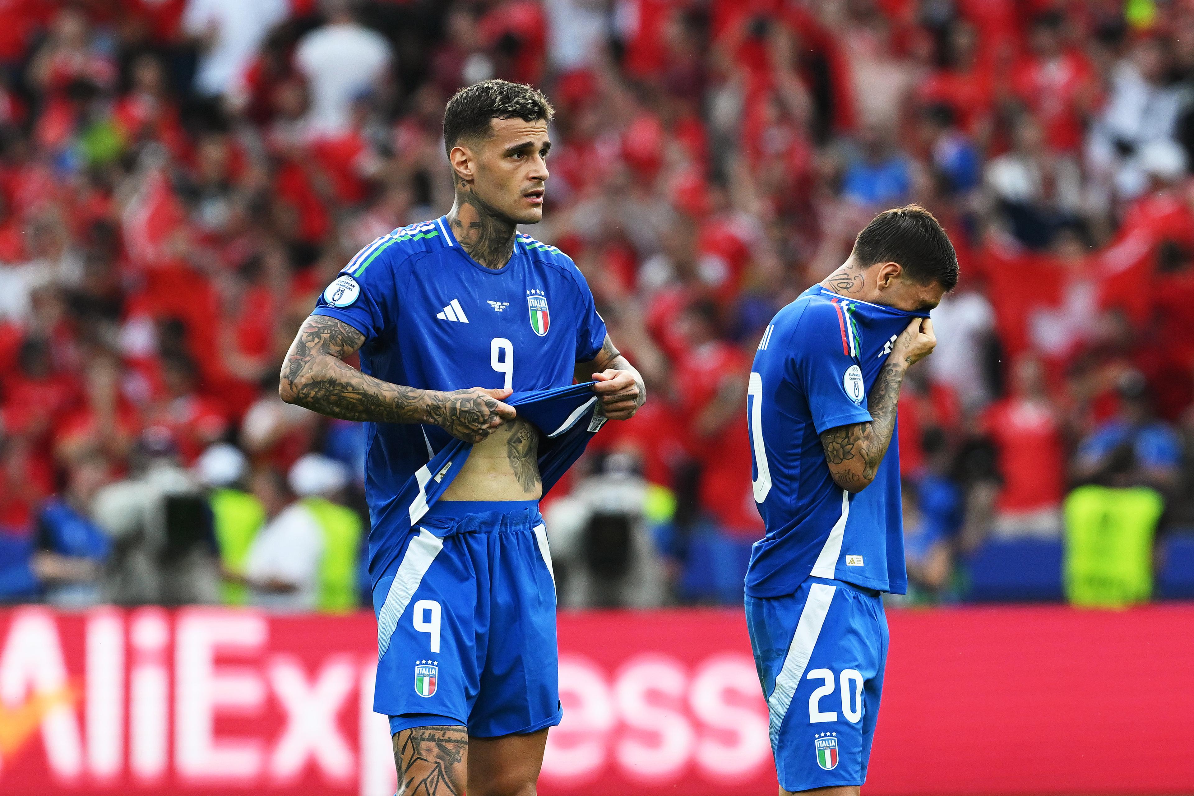 BERLIN, GERMANY - JUNE 29: Gianluca Scamacca and Mattia Zaccagni of Italy show dejection after defeat, which results in the team been knocked out of the tournament after the UEFA EURO 2024 round of 16 match between Switzerland and Italy at Olympiastadion on June 29, 2024 in Berlin, Germany. (Photo by Claudio Villa/Getty Images for FIGC)