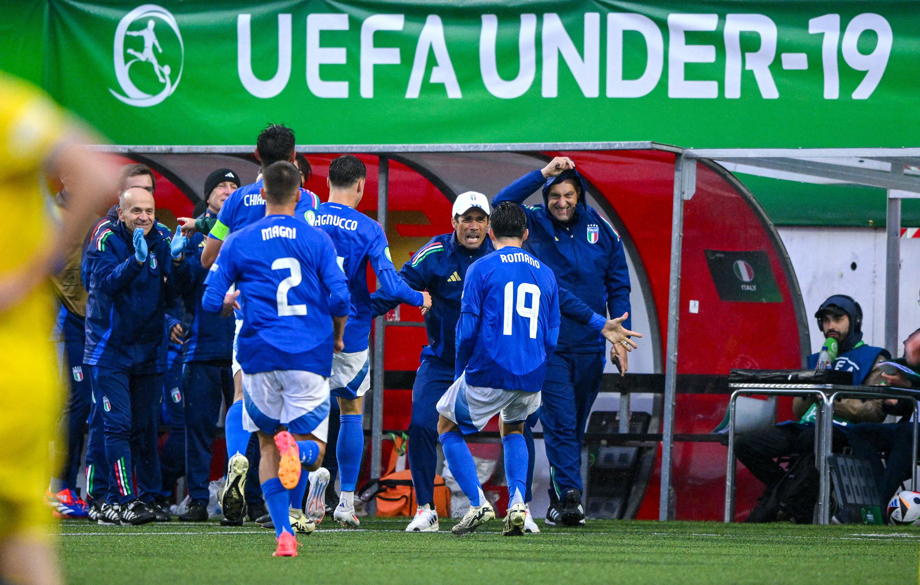 LARNE, NORTHERN IRELAND - JULY 21: Marco Romano of Italy celebrates with Italy manager Bernardo Corradi after scoring their side's second goal during the UEFA European Under-19 Championship 2024 Group A match between Ukraine and Italy at Inver Park on July 21, 2024 in Larne, Northern Ireland. (Photo by Ramsey Cardy - Sportsfile/UEFA via Getty Images)