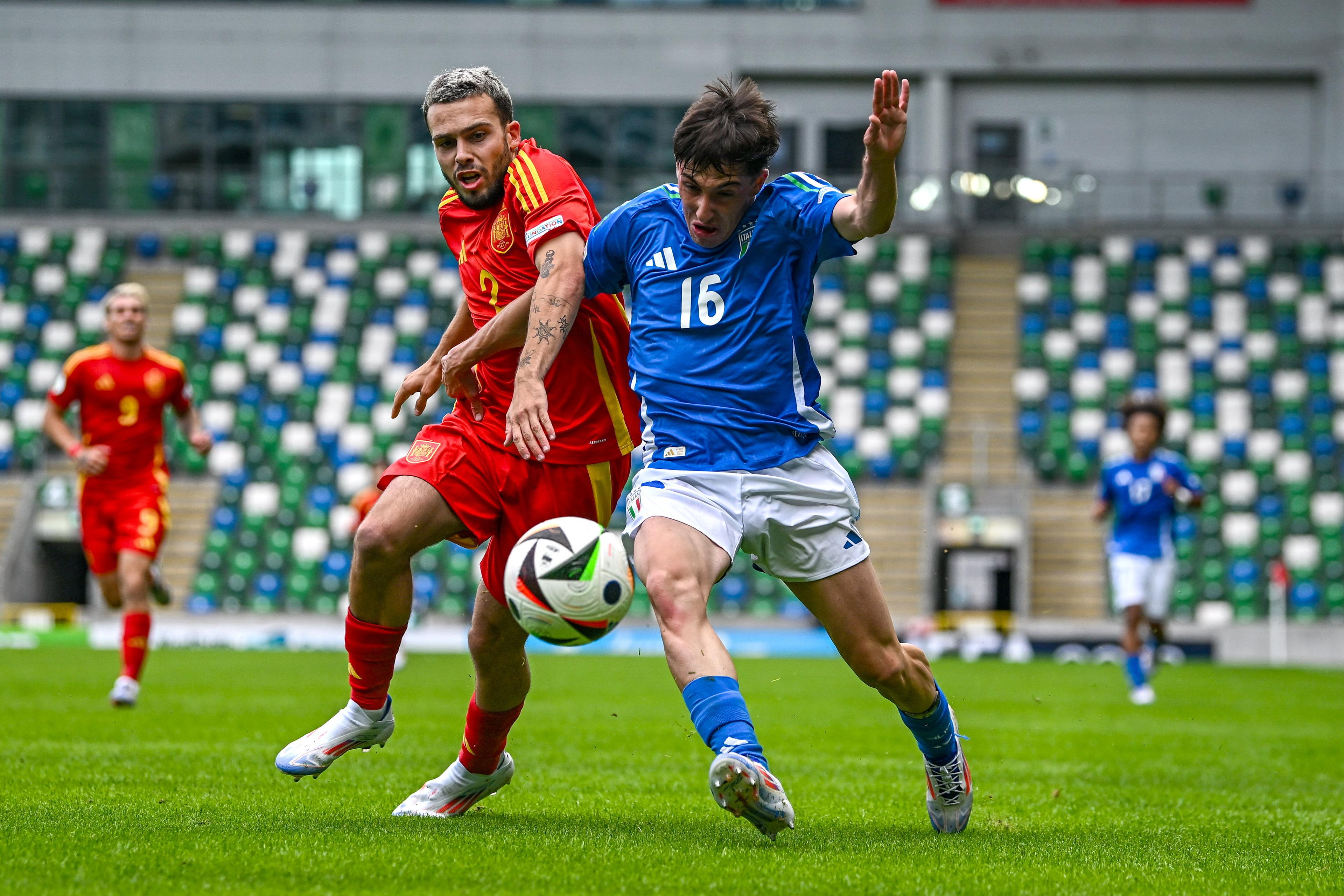 BELFAST, NORTHERN IRELAND - JULY 25: Mattia Mannini of Italy in action against David Mella of Spain during the UEFA European Under-19 Championship 2024 semi-final match between Italy and Spain at National Football Stadium at Windsor Park on July 25, 2024 in Belfast, Northern Ireland. (Photo by Seb Daly - Sportsfile/UEFA via Getty Images)