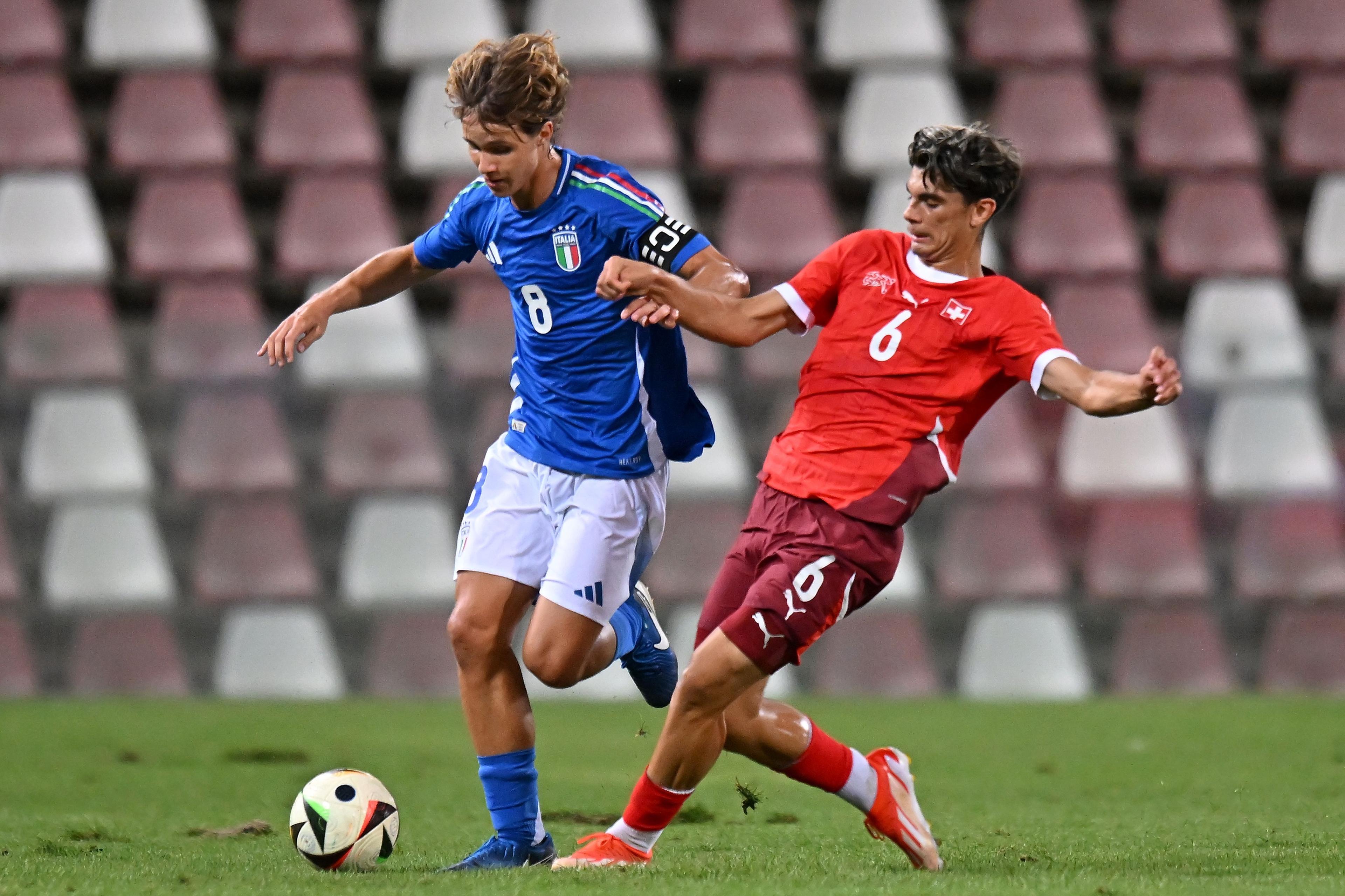 TRIESTE, ITALY - SEPTEMBER 06: Christian Comotto of Italy U17  competes for the ball with Leonit ibrahmovic of Switzerland U17during the International Friendly match between Italy U17 and Switzerland U17 at Stadio Nereo Rocco on September 06, 2024 in Trieste, Italy.  (Photo by Alessandro Sabattini/Getty Images)