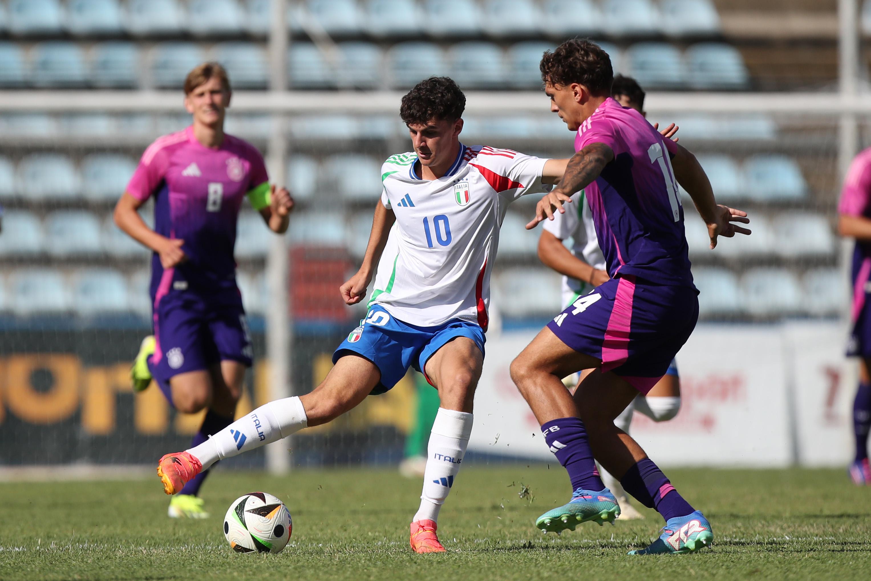 RIETI, ITALY - SEPTEMBER 10: Lorenzo Anghele of Italy U20 competes for the ball with Julian Pauli of Germany U20 during the Elite Tournament match between Italy U20 and Germany U20 at Stadio Centro D'Italia on September 10, 2024 in Rieti, Italy. (Photo by Paolo Bruno/Getty Images)