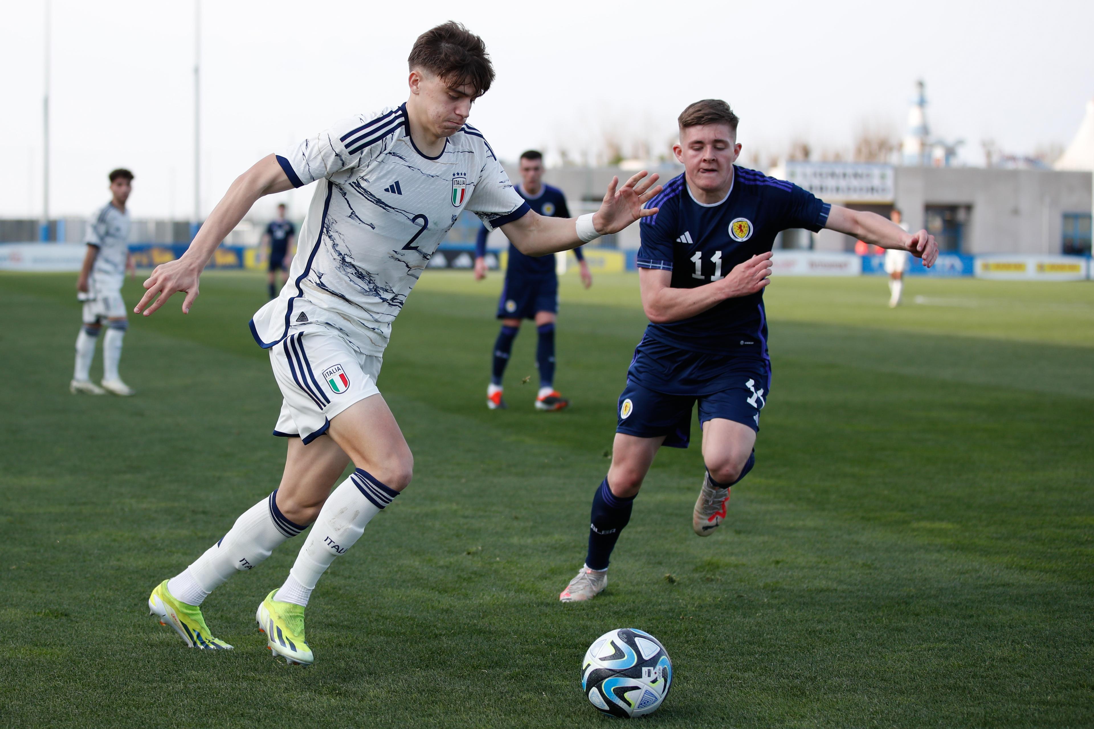 LIGNANO SABBIADORO, ITALY - MARCH 20: Marco Palestra of Italy and Daniel Kelly of Scotland during the UEFA EURO 2024 Elite Round Qualifier between Scotland U19 and Italy U19 at Stadio Guido Teghil on March 20, 2024 in Lignano Sabbiadoro, Italy. (Photo by Timothy Rogers/Getty Images)