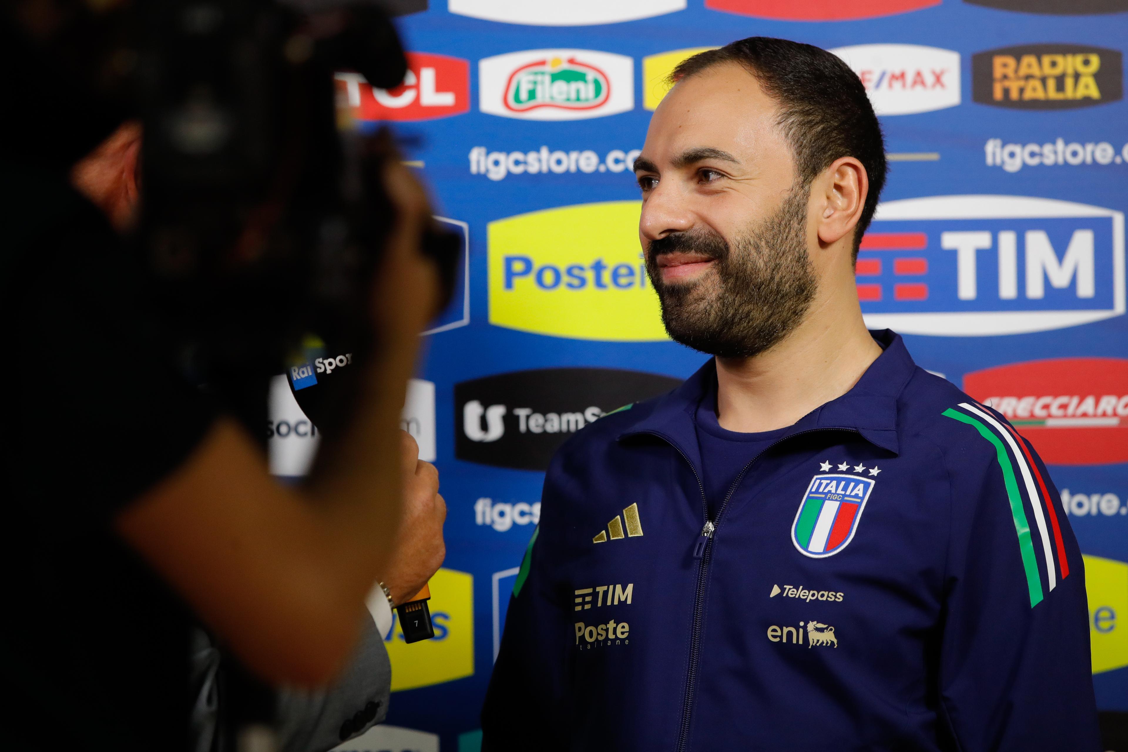SAN BONIFACIO, ITALY - NOVEMBER 04: Italy's Head Coach Salvatore Samperi (R) during a television interview before the International Friendly between Italy and Norway at Pala Ferroli on November 04, 2024 in San Bonifacio, Italy. (Photo by FIGC/FIGC via Getty Images)