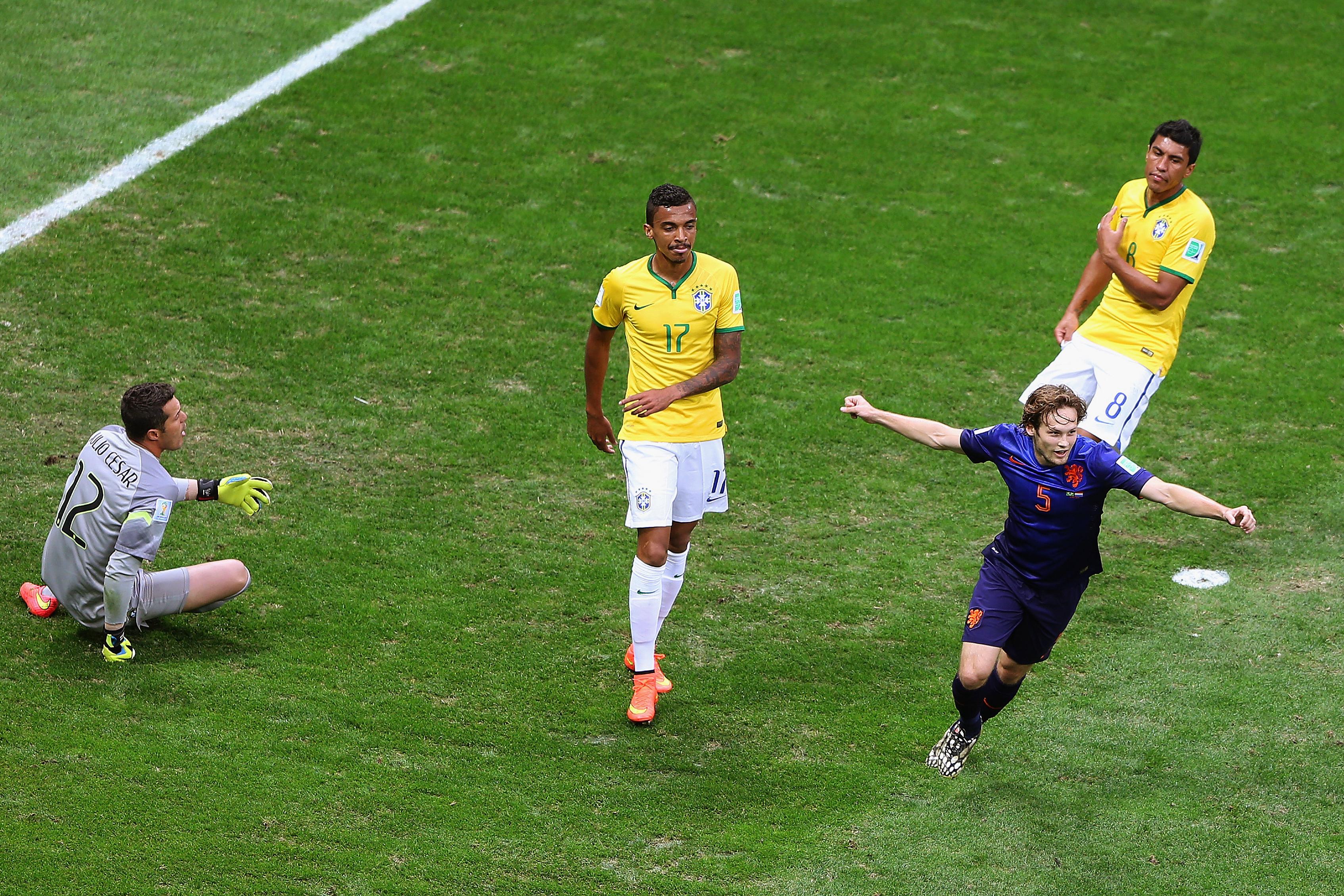 BRASILIA, BRAZIL - JULY 12: Daley Blind of the Netherlands celebrates scoring his team\\'s second goal as goalkeeper Julio Cesar (L), Luiz Gustavo (C) and Paulinho of Brazil react during the 2014 FIFA World Cup Brazil Third Place Playoff match between Brazil and the Netherlands at Estadio Nacional on July 12, 2014 in Brasilia, Brazil. (Photo by Celso Junior/Getty Images)