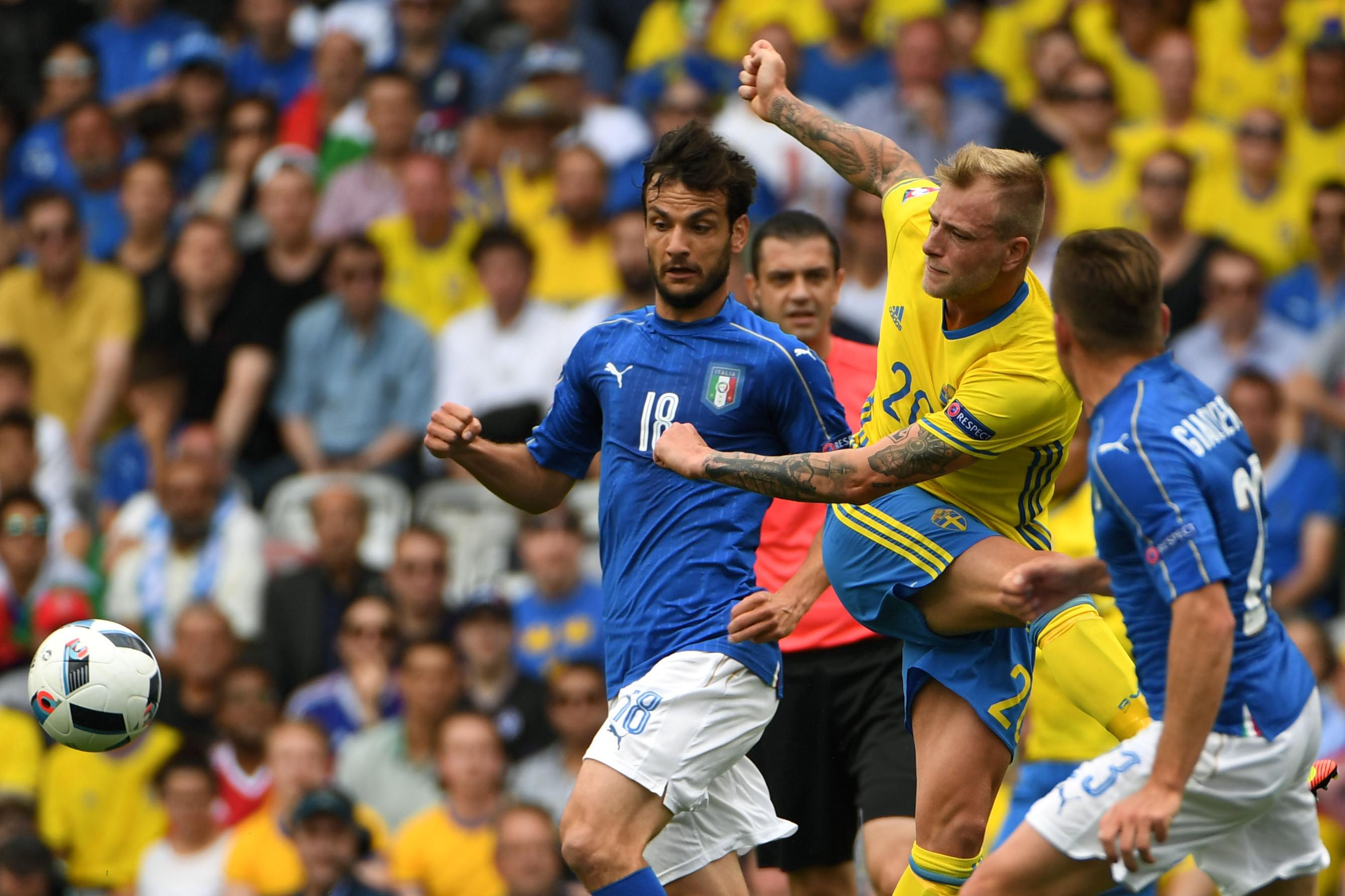 Sweden\\'s forward John Guidetti (2nd R) kicks the ball beside Italy\\'s midfielder Marco Parolo (L) during the Euro 2016 group E football match between Italy and Sweden at the Stadium Municipal in Toulouse on June 17, 2016. / AFP / PASCAL GUYOT (Photo credit should read PASCAL GUYOT/AFP/Getty Images)