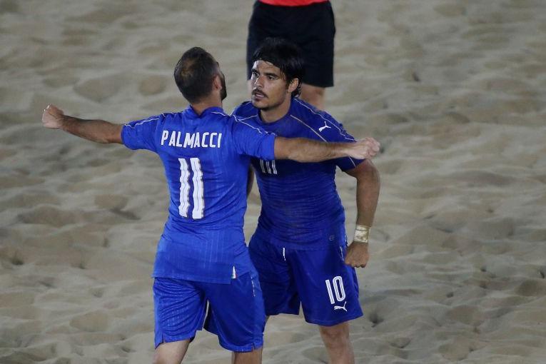 CATANIA, ITALY - MAY 31: Paolo Palmacci (L) and Gabriele Gori of Italy celebrates the winning goal during the beach soccer international frienldy between Italy and Iran on May 31, 2016 in Catania, Italy. (Photo by Maurizio Lagana/Getty Images)
