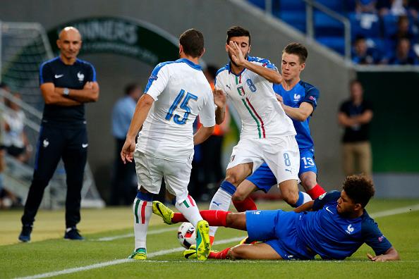 SINSHEIM, GERMANY - JULY 24: Mauro Coppalaro of Italy (L) is challenged by Dennis Will Poha of France during the UEFA Under19 European Championship Final match between U19 France and U19 Italy at Wirsol Rhein-Neckar-Arena on July 24, 2016 in Sinsheim, Germany. (Photo by Ronald Wittek/Bongarts/Getty Images)