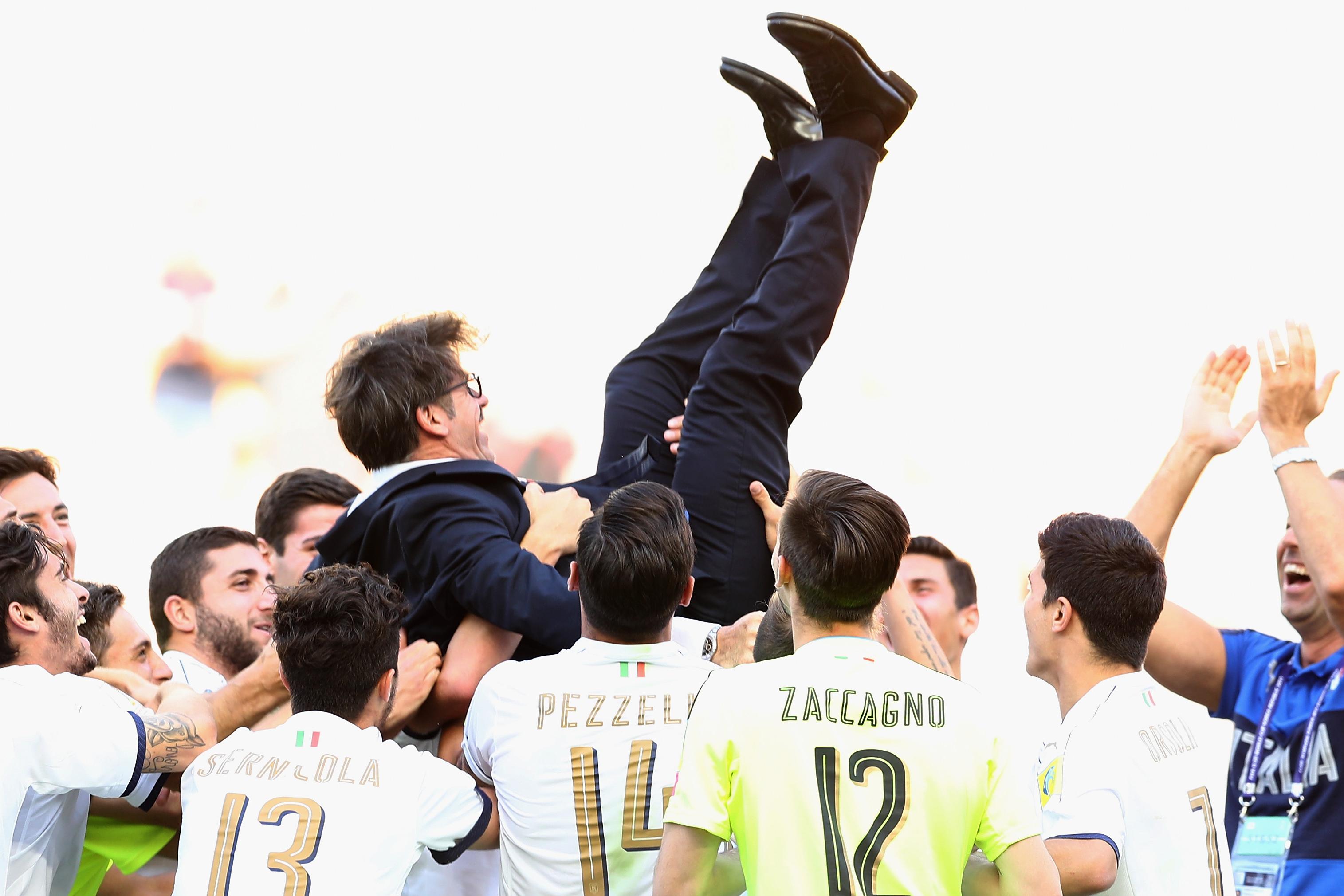 SUWON, SOUTH KOREA - JUNE 11: Players of Italy throw head coach Alberico Evani of Italy up in the air after winning the FIFA U-20 World Cup Korea Republic 2017 3rd rank playoff match between Uruguay and Italy at Suwon World Cup Stadium on June 11, 2017 in Suwon, South Korea. (Photo by Lars Baron - FIFA/FIFA via Getty Images)