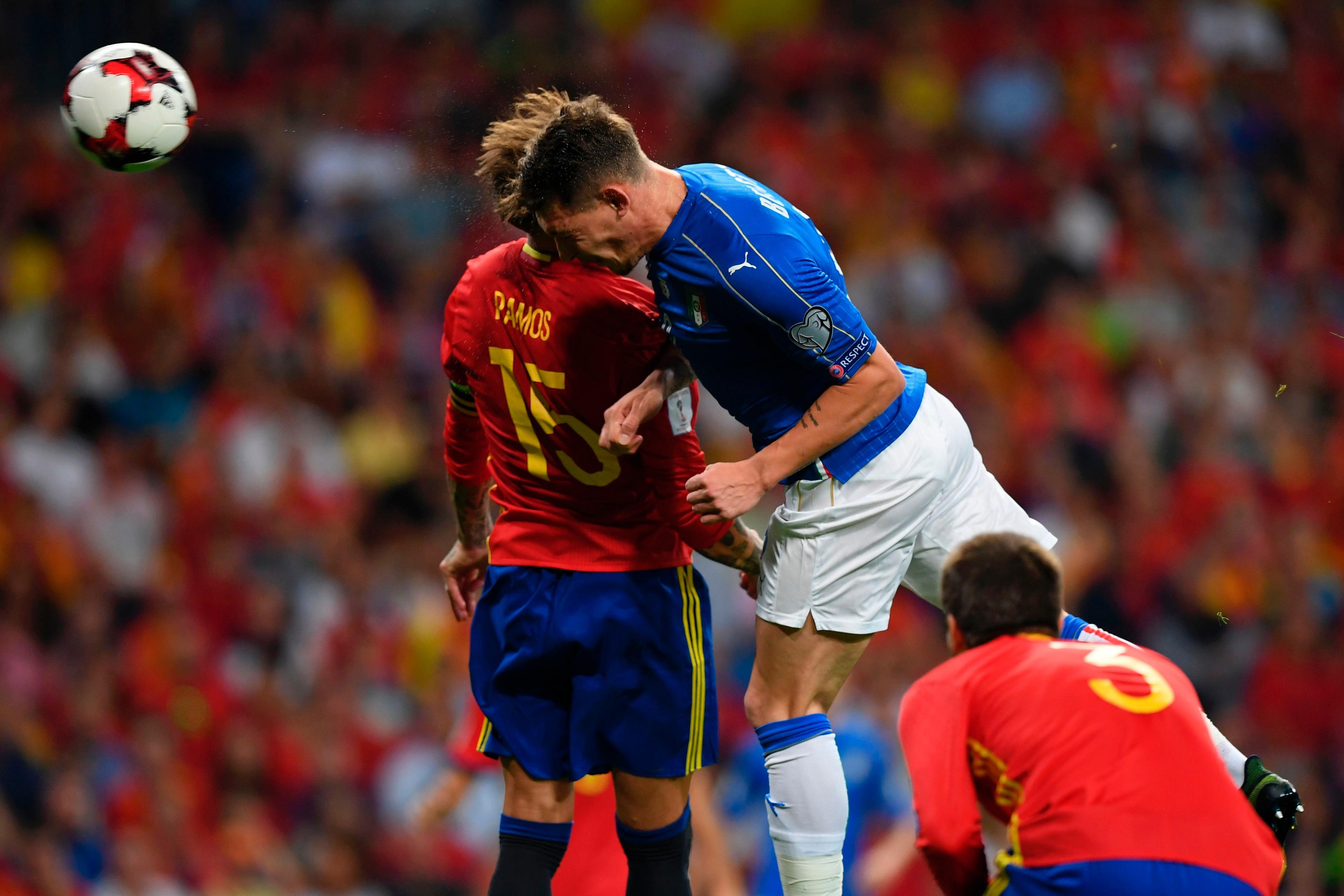 Spain\\'s defender Sergio Ramos (L) vies with Italy\\'s forward Andrea Belotti during the World Cup 2018 qualifier football match Spain vs Italy at the Santiago Bernabeu stadium in Madrid on September 2, 2017. / AFP PHOTO / GABRIEL BOUYS        (Photo credit should read GABRIEL BOUYS/AFP/Getty Images)