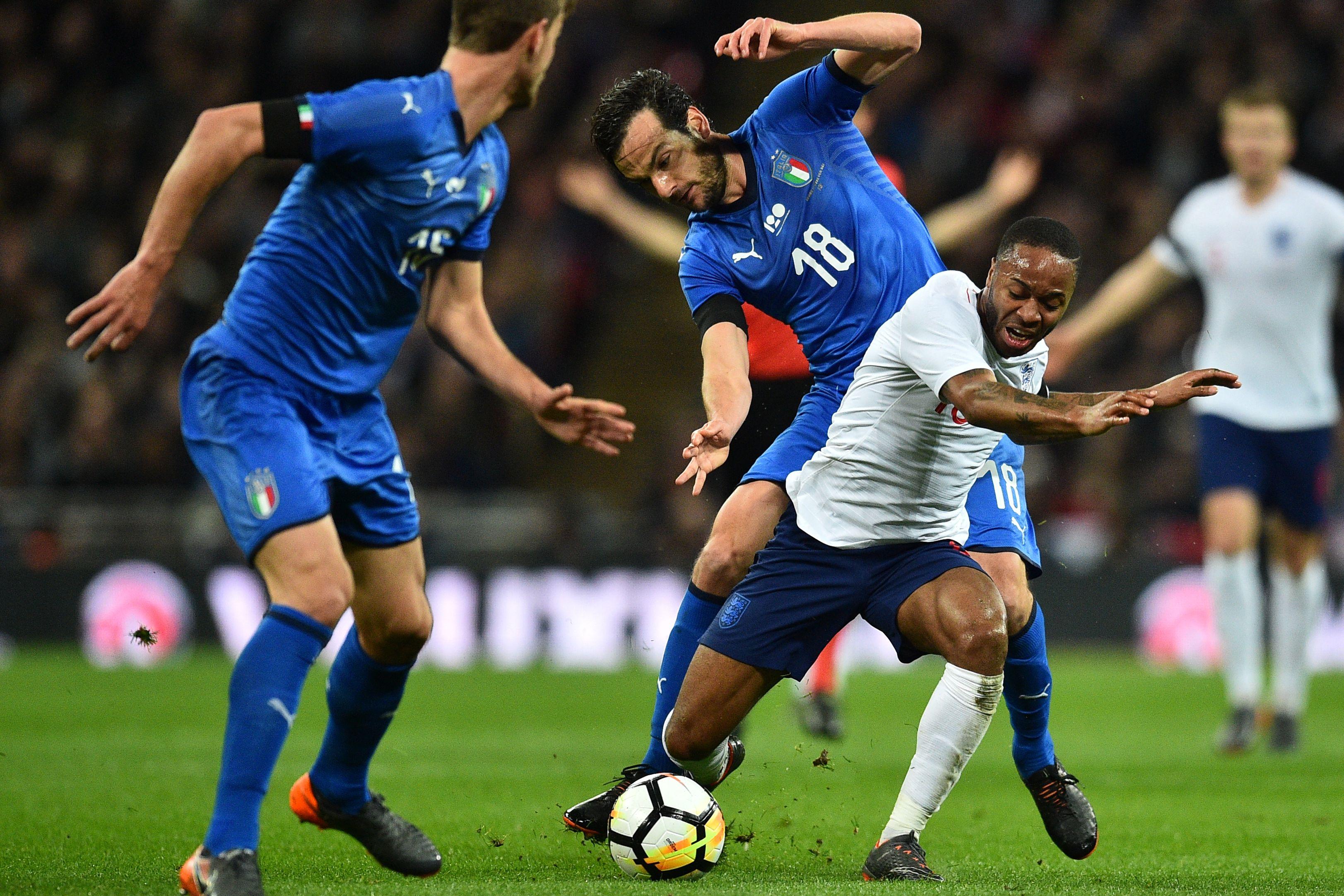 England\\'s midfielder Raheem Sterling (R) vies with Italy\\'s midfielder Marco Parolo during the International friendly football match between England and Italy at Wembley stadium in London on March 27, 2018. / AFP PHOTO / Glyn KIRK        (Photo credit should read GLYN KIRK/AFP/Getty Images)