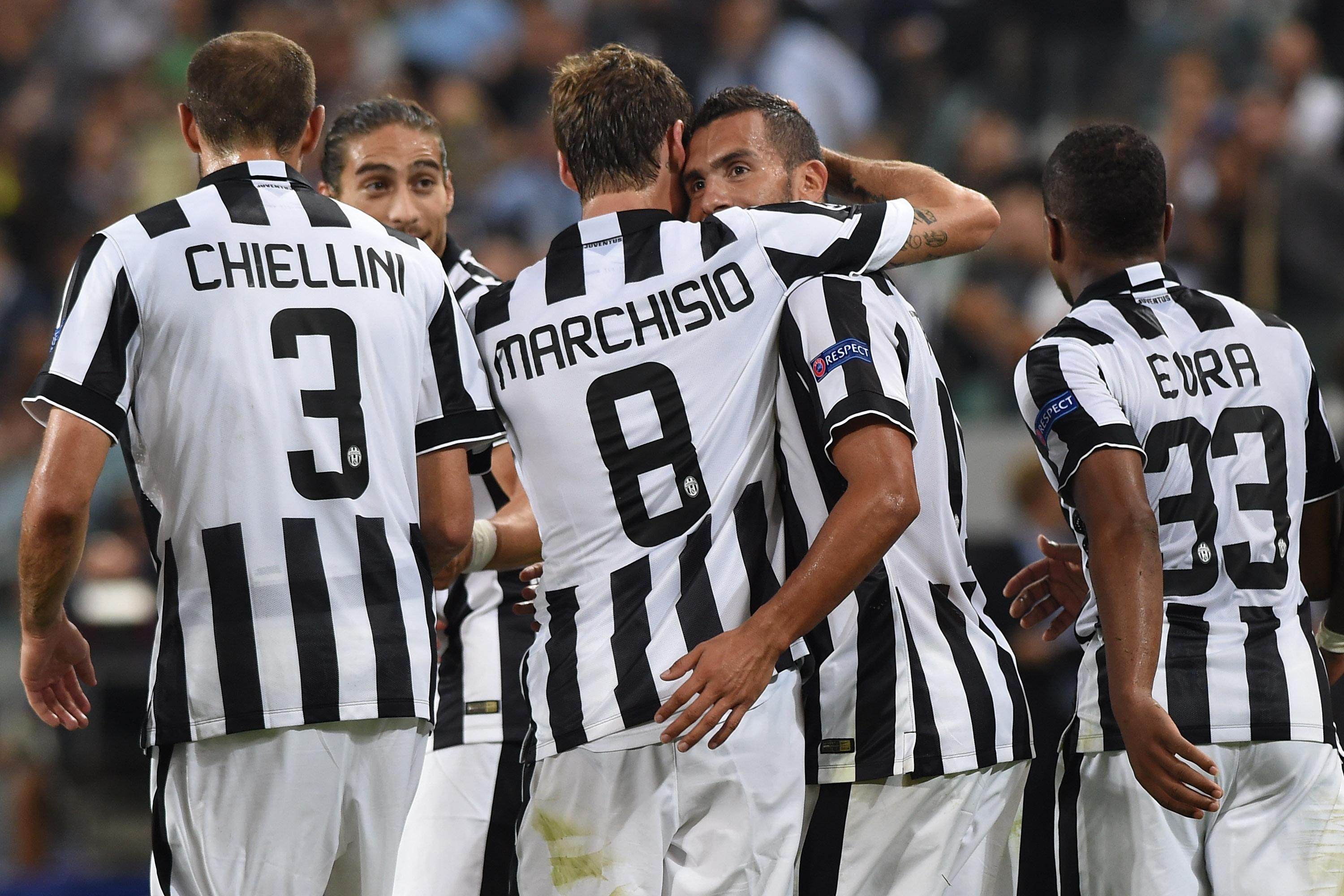 TURIN, ITALY - SEPTEMBER 16: Carlos Tevez (2nd R) of Juventus celebrates his second goal with team-mates Claudio Marchisio during the UEFA Champions League Group A match between Juventus and Malmo FF on September 16, 2014 in Turin, Italy. (Photo by Valerio Pennicino/Getty Images)