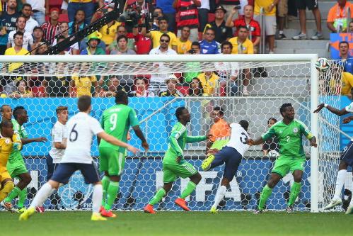 BRASILIA, BRAZIL - JUNE 30:  Paul Pogba of France scores his team\\'s first goal on a header past goalkeeper Vincent Enyeama of Nigeria during the 2014 FIFA World Cup Brazil Round of 16 match between France and Nigeria at Estadio Nacional on June 30, 2014 in Brasilia, Brazil.  (Photo by Ian Walton/Getty Images)