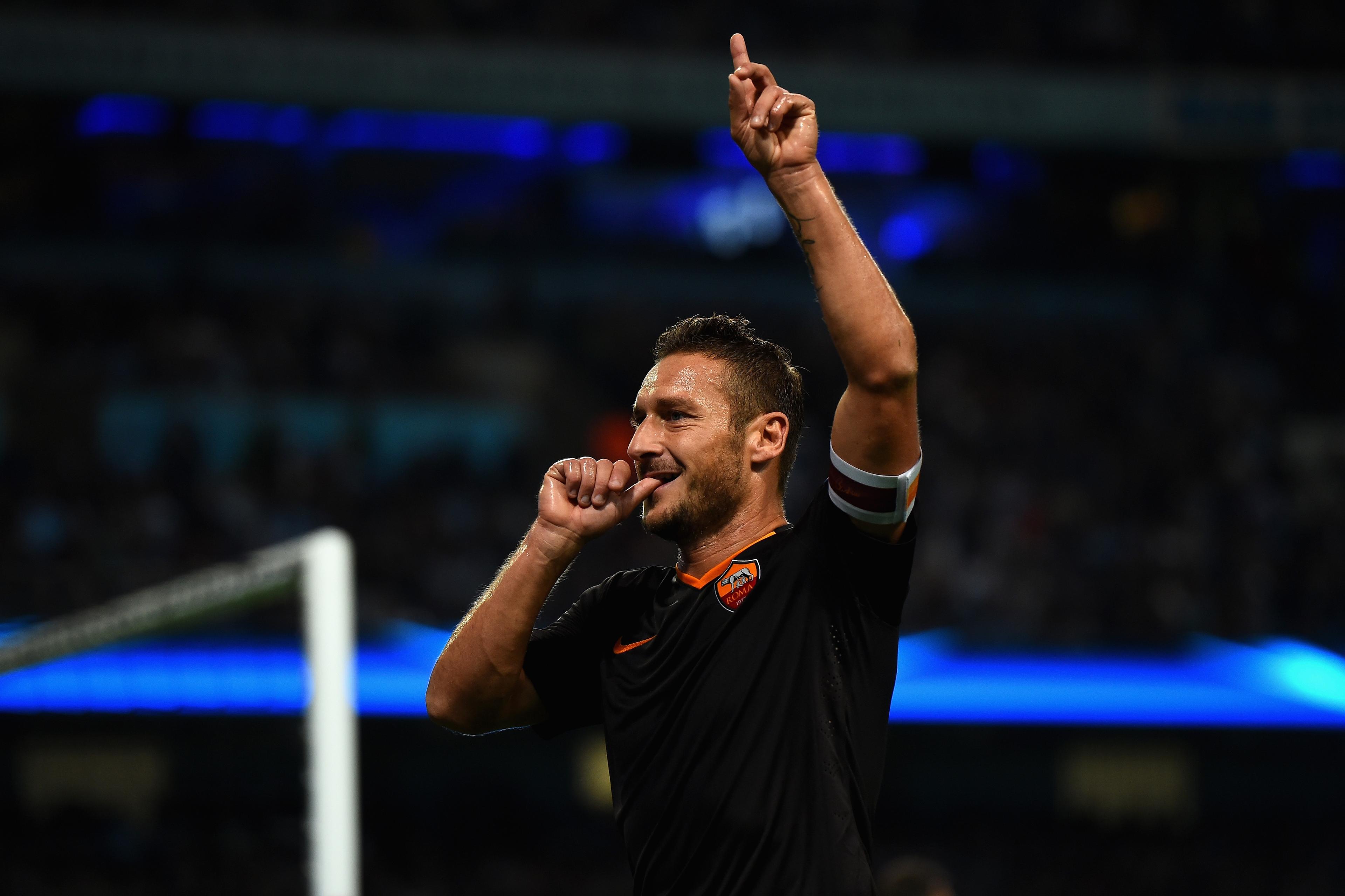 MANCHESTER, ENGLAND - SEPTEMBER 30: Francesco Totti of AS Roma celebrates scoring his team\\'s first goal during the UEFA Champions League Group E match between Manchester City FC and AS Roma on September 30, 2014 in Manchester, United Kingdom. (Photo by Laurence Griffiths/Getty Images)