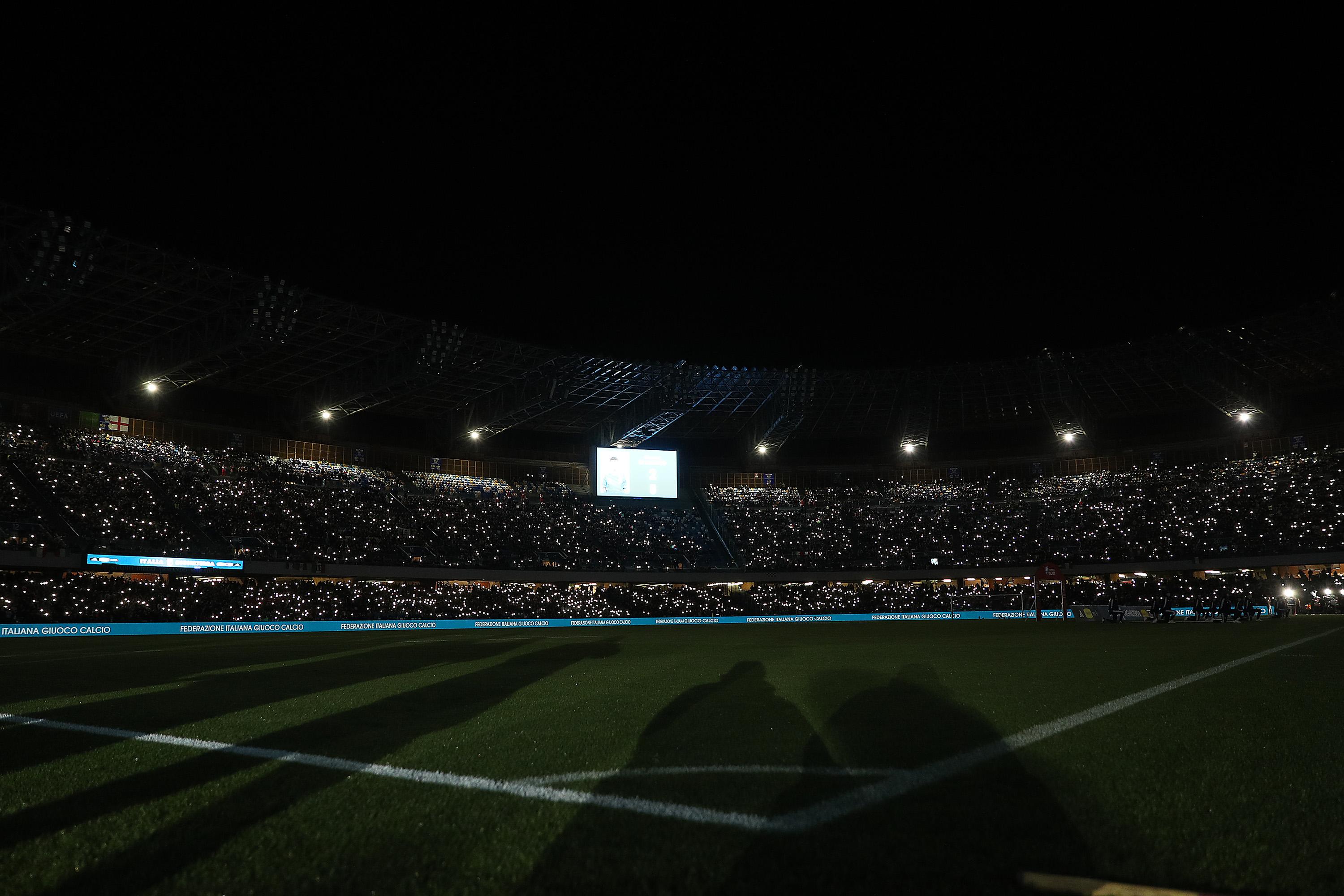 NAPLES, ITALY - MARCH 23: Italy supporters turn on their cellphone lights before the UEFA EURO 2024 qualifying round group C match between Italy and England at Stadio Diego Armando Maradona on March 23, 2023 in Naples, Italy. (Photo by Francesco Pecoraro/Getty Images)