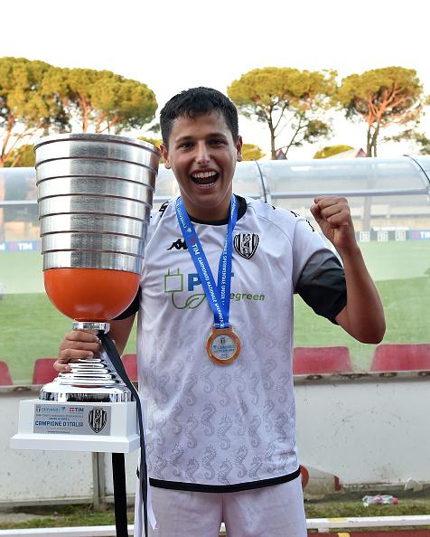TOLENTINO, ITALY - JUNE 16: Filippo Bertaccini of Cesena celebrates the victory with the cup after the Serie C U16 Final match between Cesena and Vicenza on June 16, 2023 in Tolentino, Italy. (Photo by Giuseppe Bellini/Getty Images)
