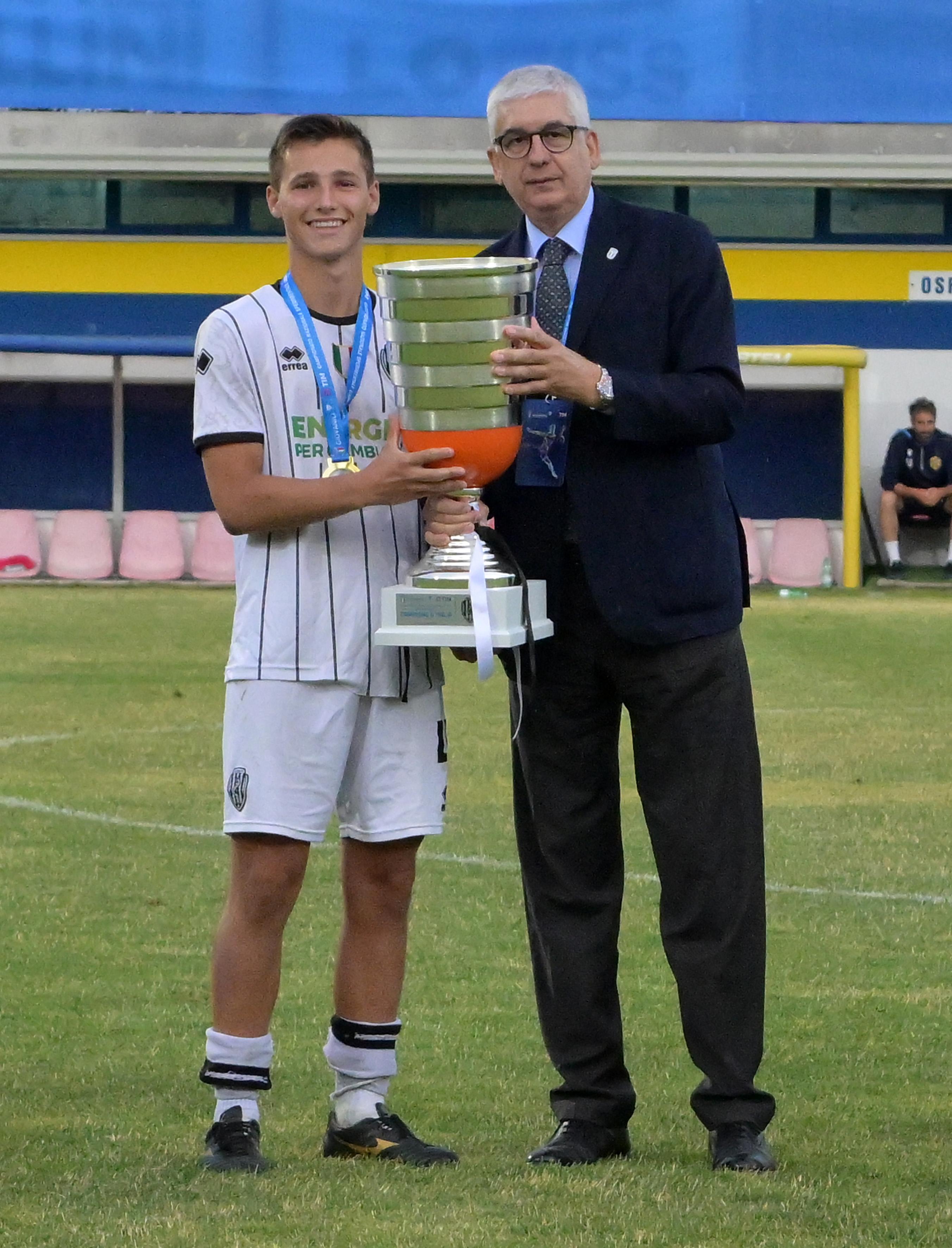 FERMO, ITALY - JUNE 23: Vito Roberto Tisci President of the Youth and School Sector of the FIGC awards, and Alessandro Pezzi as captain of Team Cesena after the Serie C U16 Final match between Cesena and Virtus Entella at Stadio Bruno Recchioni on June 23, 2024 in Fermo, Italy. (Photo by Giuseppe Bellini/Getty Images)