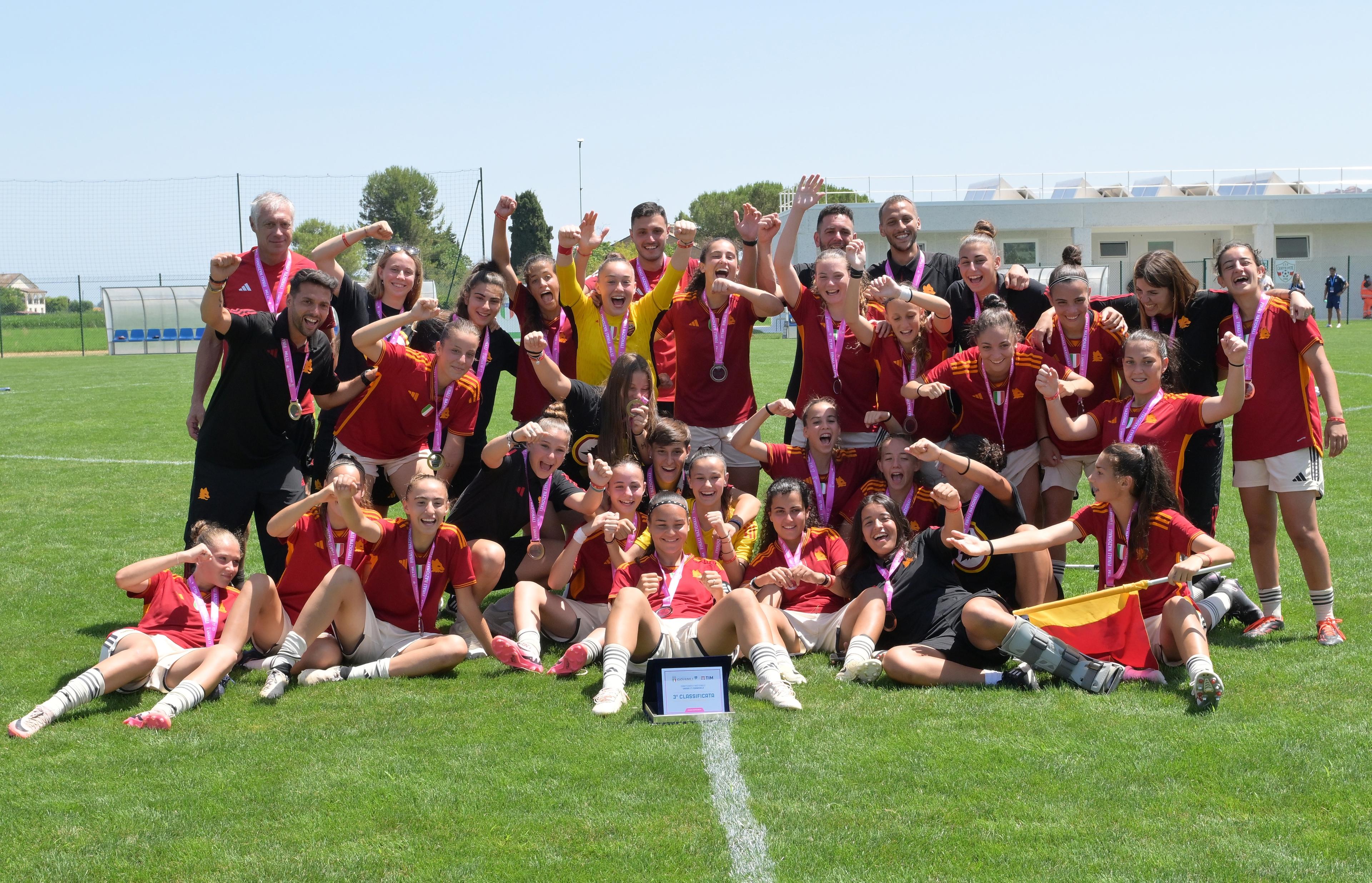 FERMO, ITALY - JUNE 30: Players of AS Roma celebrate the victory after the U17 Women 3rd Place Final match between Arezzo and AS Roma at Stadio Della Valle on June 30, 2024 in Casette d'Ete , Italy. (Photo by Giuseppe Bellini/Getty Images)