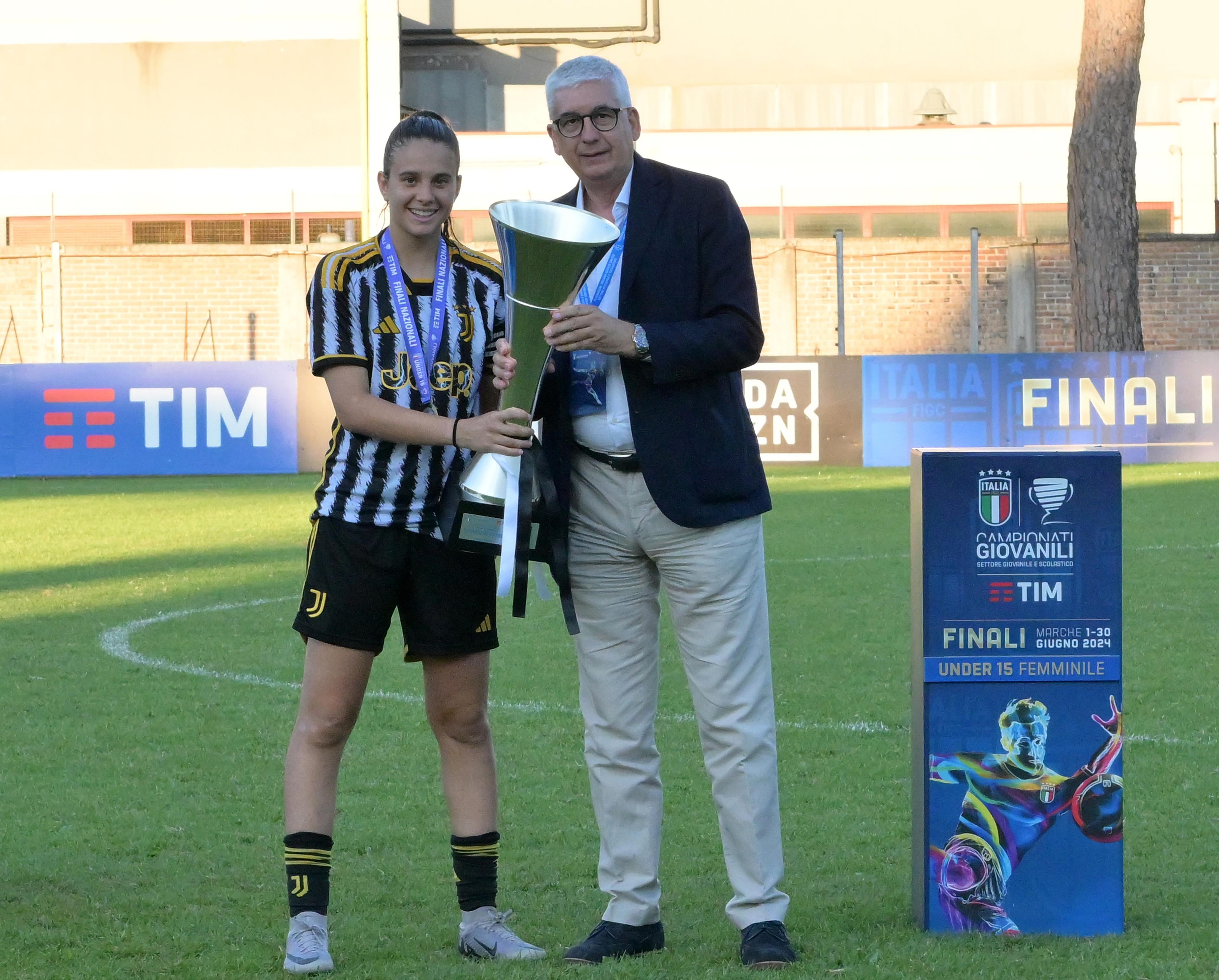 TOLENTINO, ITALY - JUNE 27: Vito Roberto Tisci President of the Youth and School Sector of the FIGC awards, and Daria Rosso of as captain of Team Juventus after the U15Women Final match between AS Roma and Juventus at on June 27, 2024 in Tolentino, Italy. (Photo by Giuseppe Bellini/Getty Images)