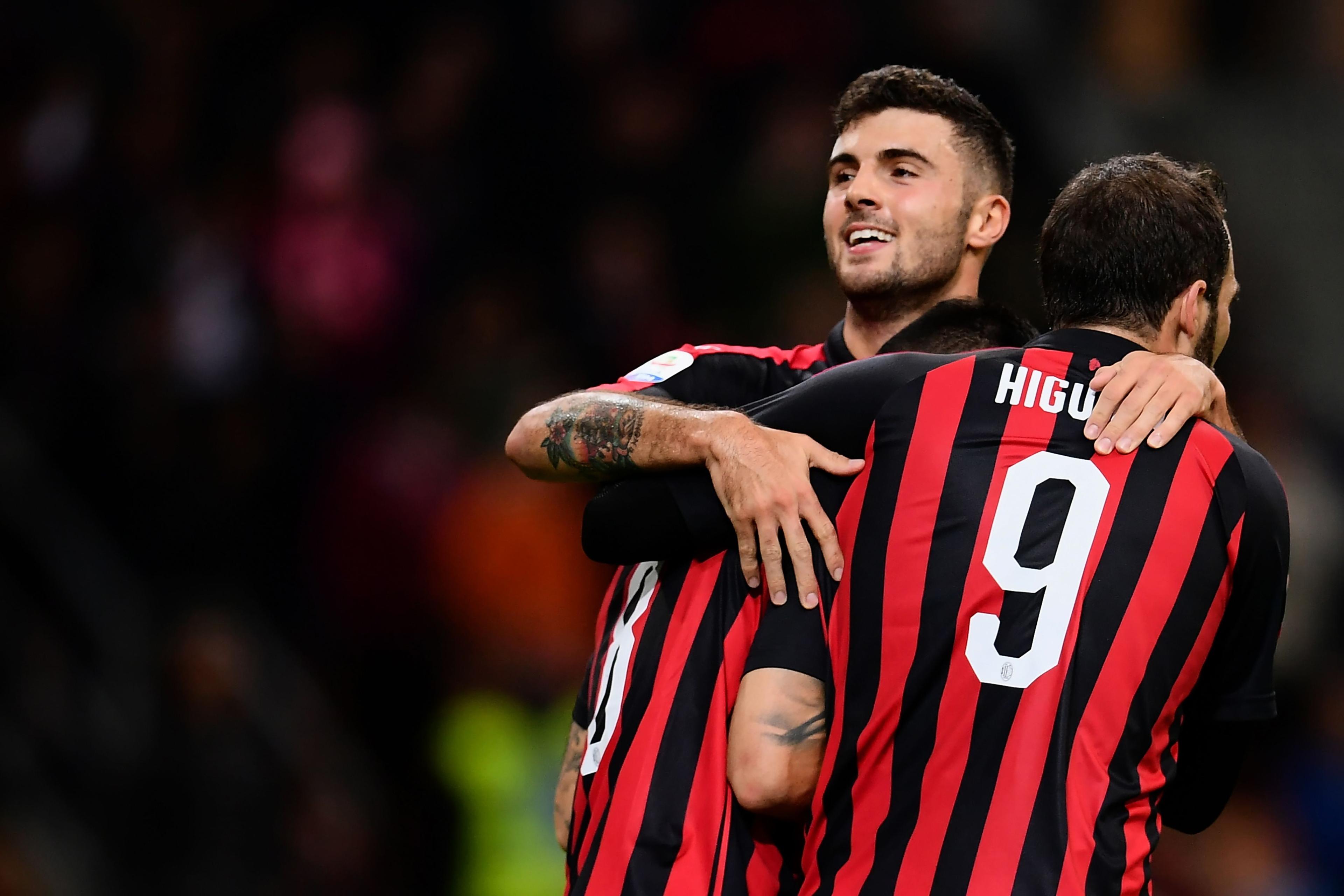 AC Milan\\'s midfielder Suso from Spain (L) celebrates after scoring with his teammate AC Milan\\'s forward Patrick Cutrone from Italy (C) and AC Milan\\'s Argentinian forward Gonzalo Higuain (R) during the Italian Serie A football match AC Milan vs Sampdoria on October 28, 2018 at the \\'Giuseppe Meazza Stadium\\' in Milan. (Photo by MARCO BERTORELLO / AFP) (Photo credit should read MARCO BERTORELLO/AFP/Getty Images)