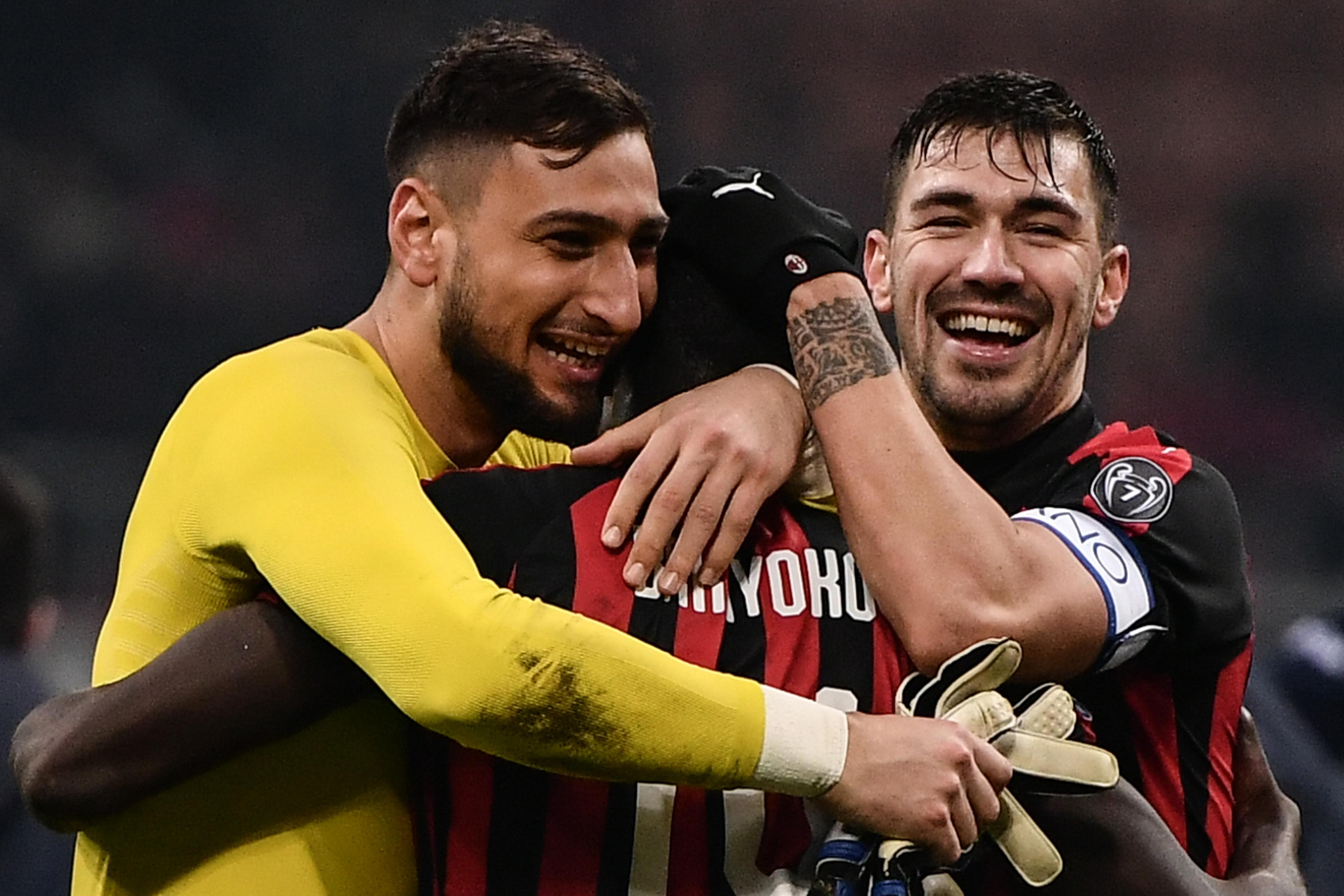 (From L) AC Milan\\'s Italian goalkeeper Gianluigi Donnarumma, AC Milan\\'s French midfielder Tiemoue Bakayoko and AC Milan\\'s Italian defender Alessio Romagnoli celebrate at the end of the Italian Serie A football match AC Milan vs Spal on December 29, 2018 at San Siro stadium in Milan. (Photo by Marco BERTORELLO / AFP)        (Photo credit should read MARCO BERTORELLO/AFP/Getty Images)