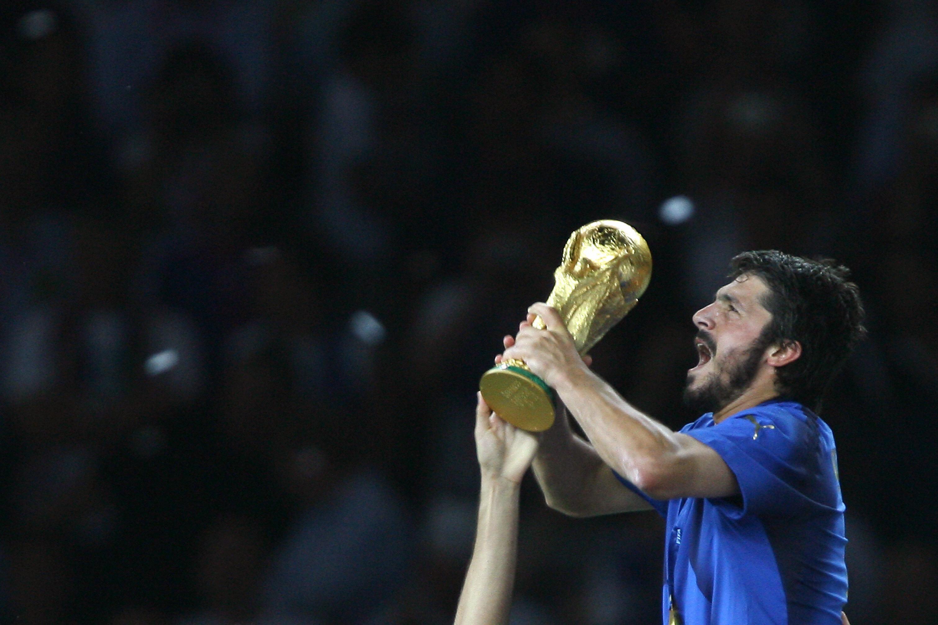 Berlin, GERMANY:  Italian midfielder Gennaro Gattuso celebrates with the trophy after the World Cup 2006 final football game Italy vs.France, 09 July 2006 at Berlin stadium.  Italy won the 2006 football World Cup by defeating France on penalties. AFP PHOTO PATRICK HERTZOG  (Photo credit should read PATRICK HERTZOG/AFP/Getty Images)