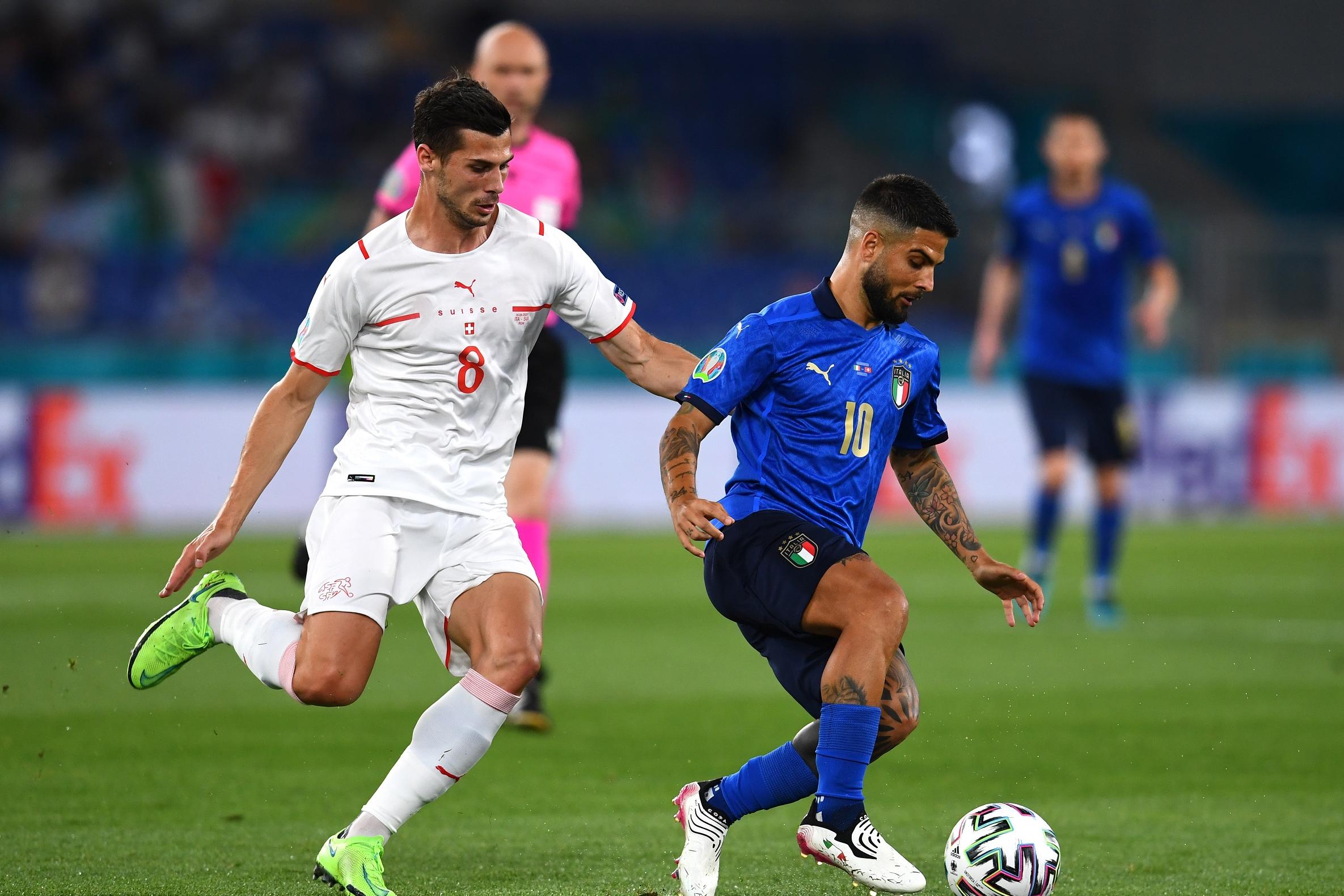 ROME, ITALY - JUNE 16: Lorenzo Insigne of Italy is closed down by Remo Freuler of Switzerland during the UEFA Euro 2020 Championship Group A match between Italy and Switzerland at Olimpico Stadium on June 16, 2021 in Rome, Italy. (Photo by Claudio Villa/Getty Images)