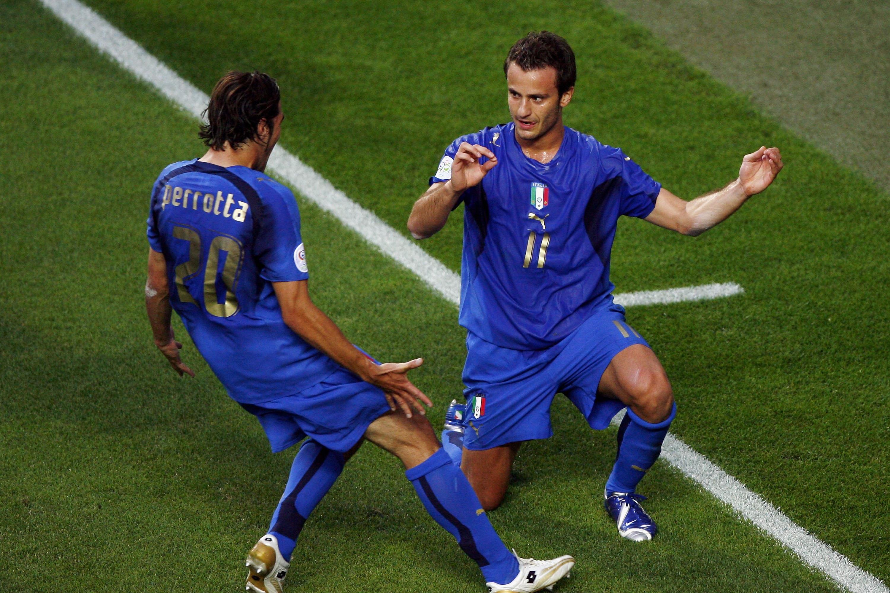KAISERSLAUTERN, GERMANY - JUNE 17:  Alberto Gilardino #11 (R) of Italy, is congratulated by teammate Simone Perrotta, after scoring the opening goal during the FIFA World Cup Germany 2006 Group E match between Italy and USA at the Fritz-Walter Stadium on June 17, 2006 in Kaiserslautern, Germany.  (Photo by Michael Steele/Getty Images)