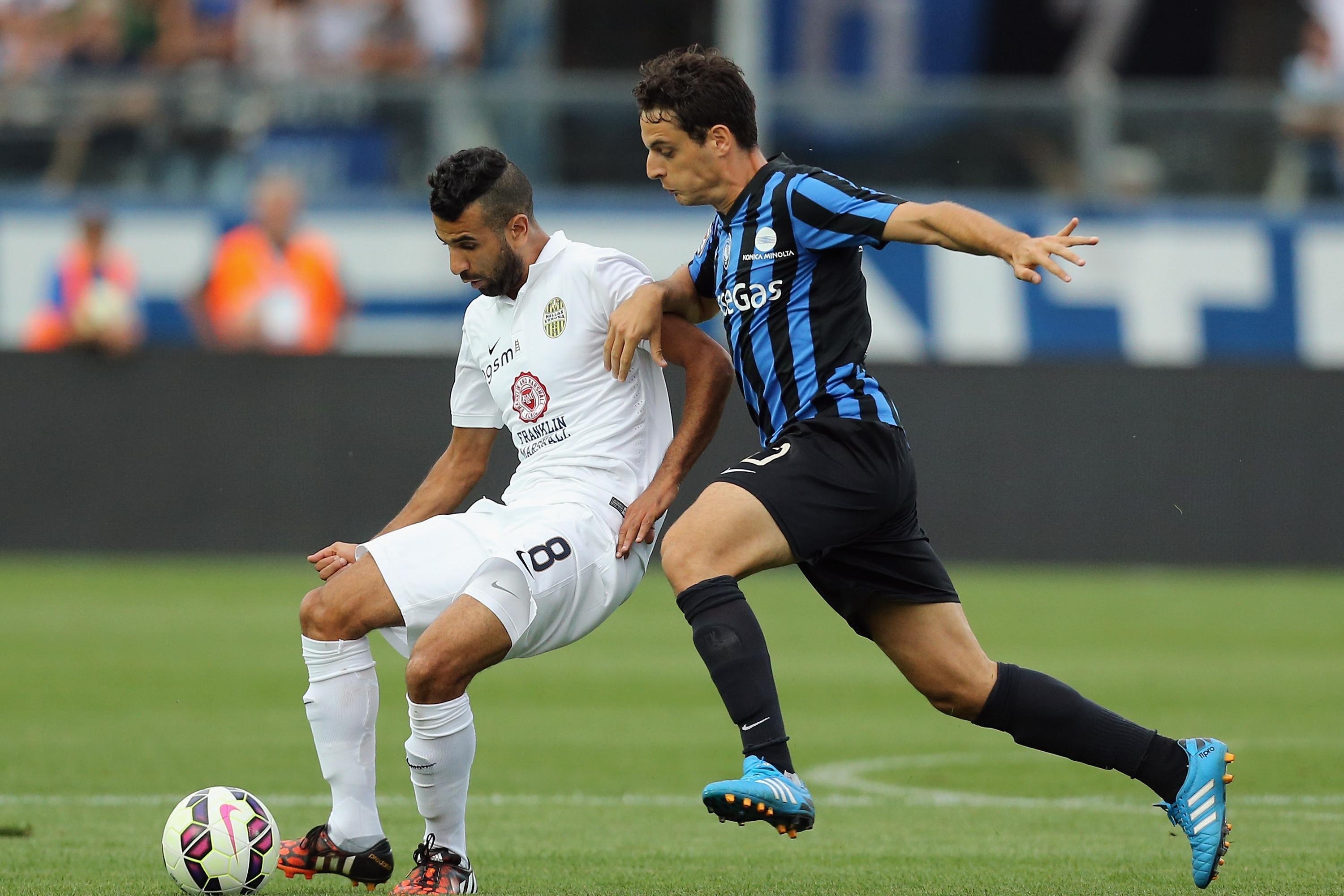 BERGAMO, ITALY - AUGUST 31:  Giacomo Bonaventura (R) of Atalanta competes for the ball with Mounir Obbadi of Verona during the Serie A match between Atalanta BC and Hellas Verona FC at Stadio Atleti Azzurri d\\'Italia on August 31, 2014 in Bergamo, Italy.  (Photo by Maurizio Lagana/Getty Images)